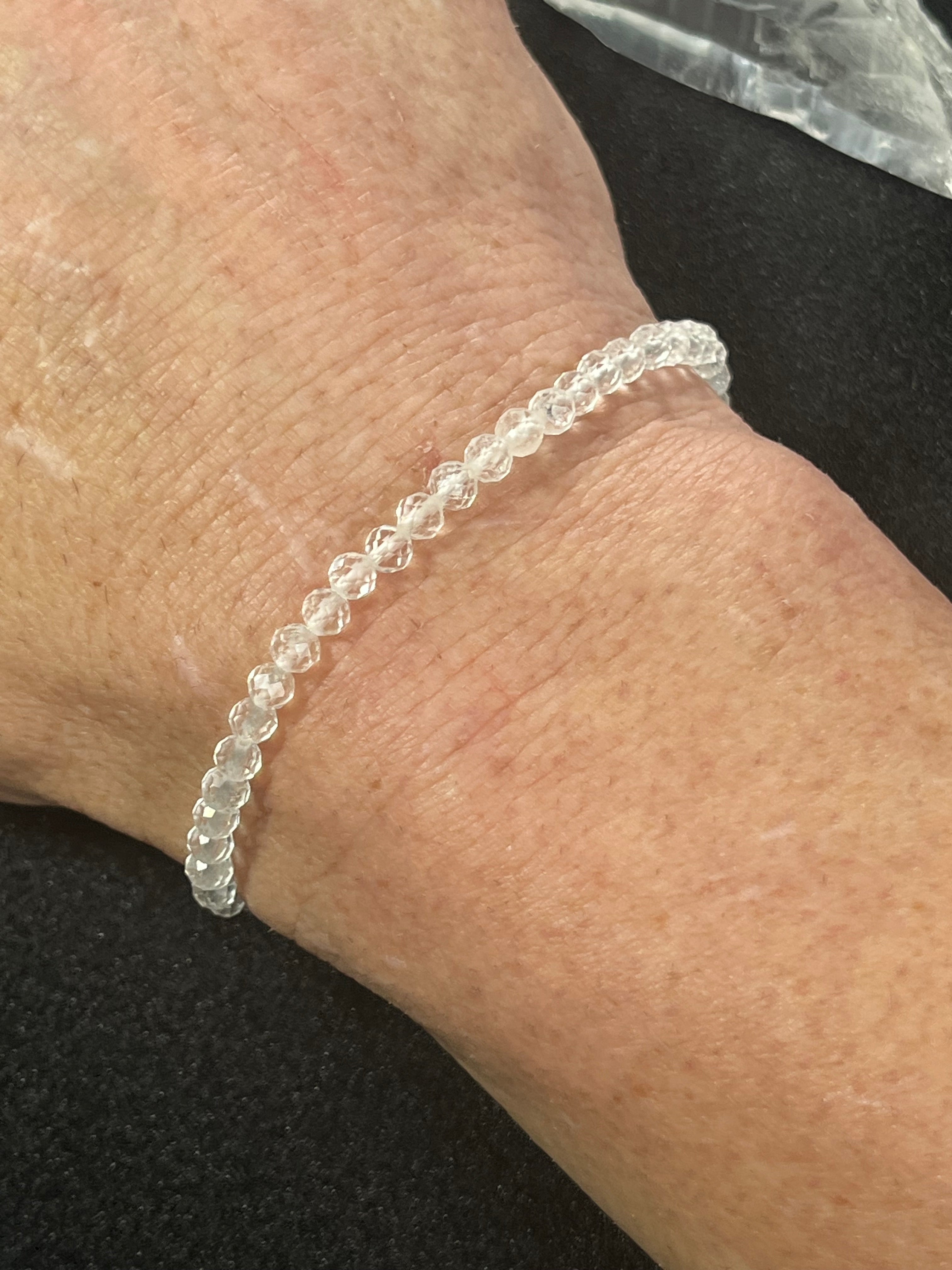 Clear Crystal Quartz faceted round 4mm bead stretch bracelet (premium)