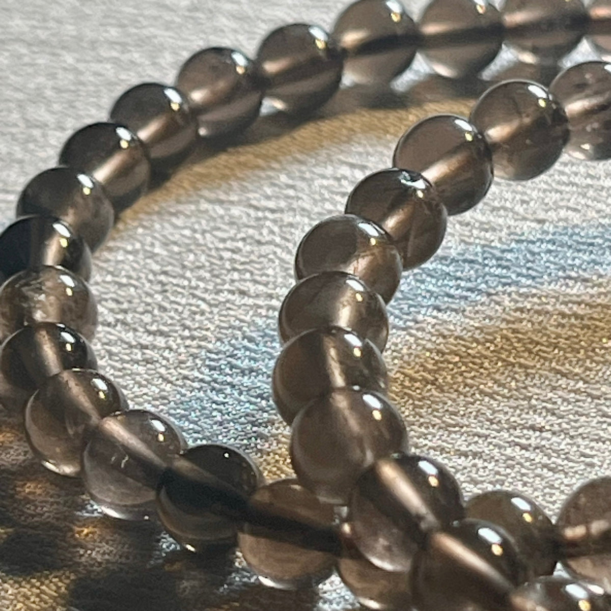 Smoky Quartz smooth round 6mm bead stretch bracelet (AA grade)
