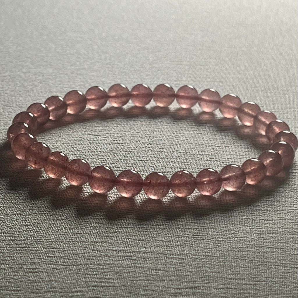 Strawberry Quartz smooth round 6mm bead stretch bracelet (AA grade)