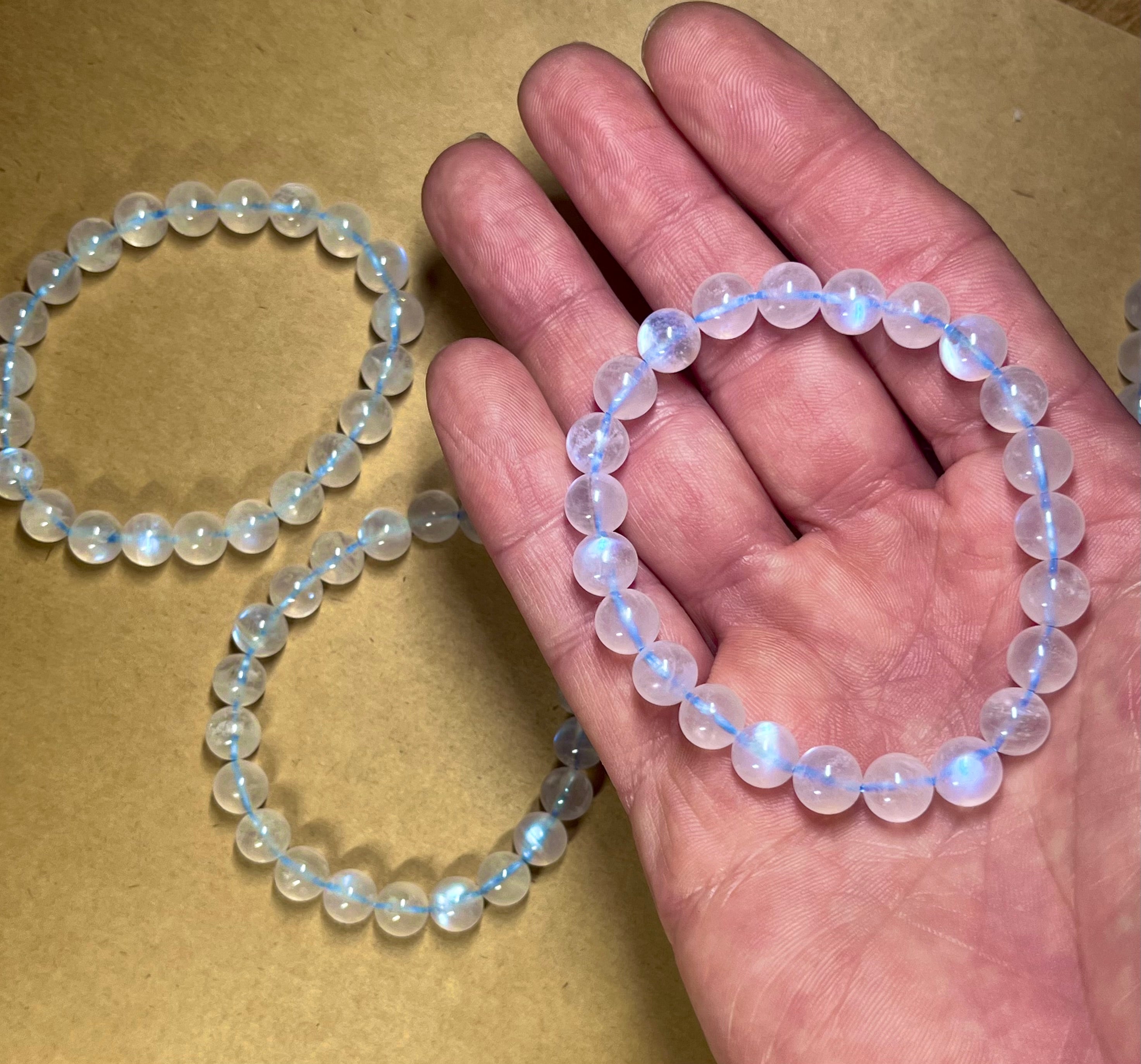 Blue Moonstone smooth round 8mm high-clarity blue flash bead stretch bracelet; June birthstone