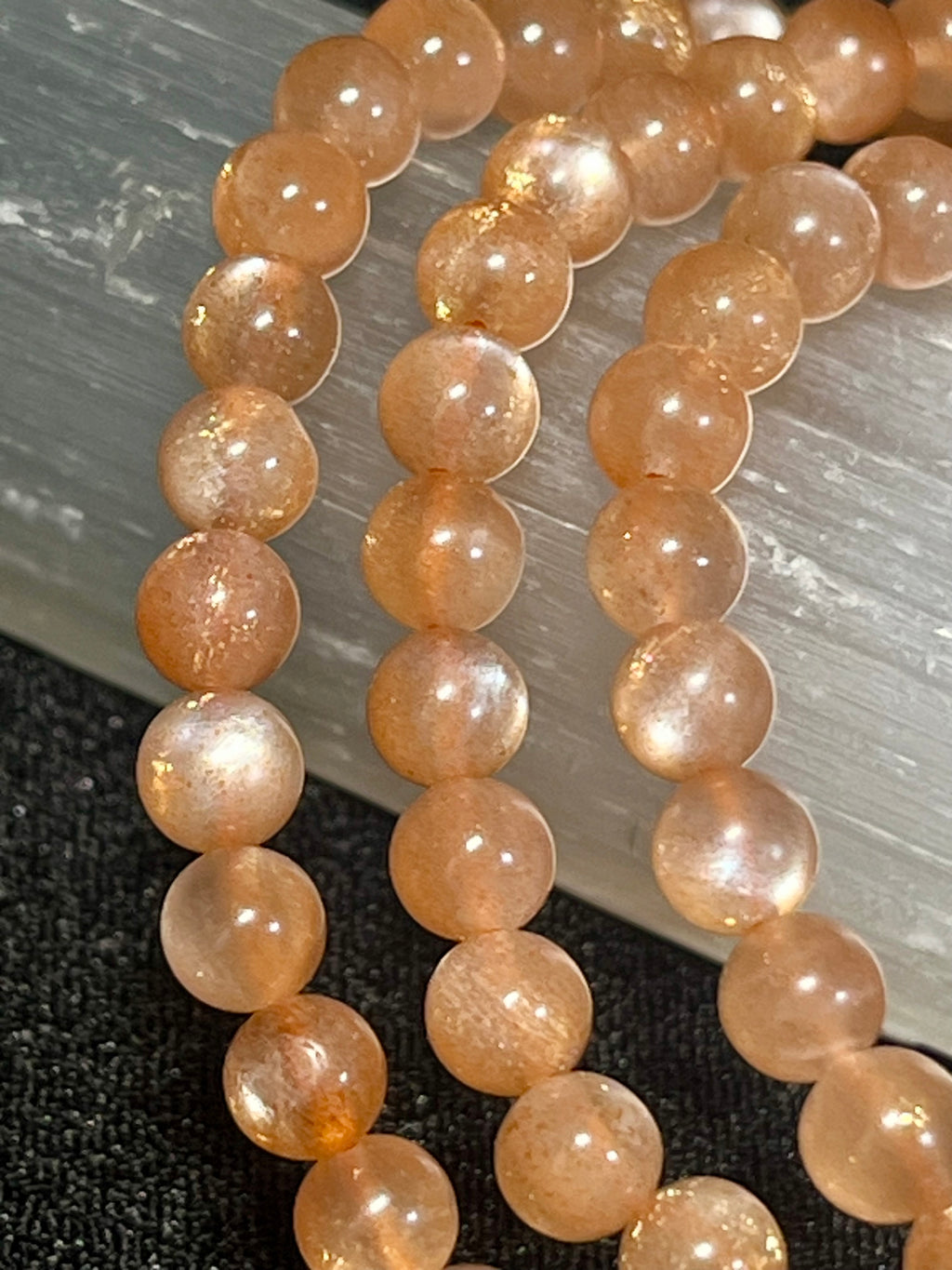 Sunstone w/ strong Moonstone-like adularescence smooth round 4mm bead stretch bracelets (premium grade)