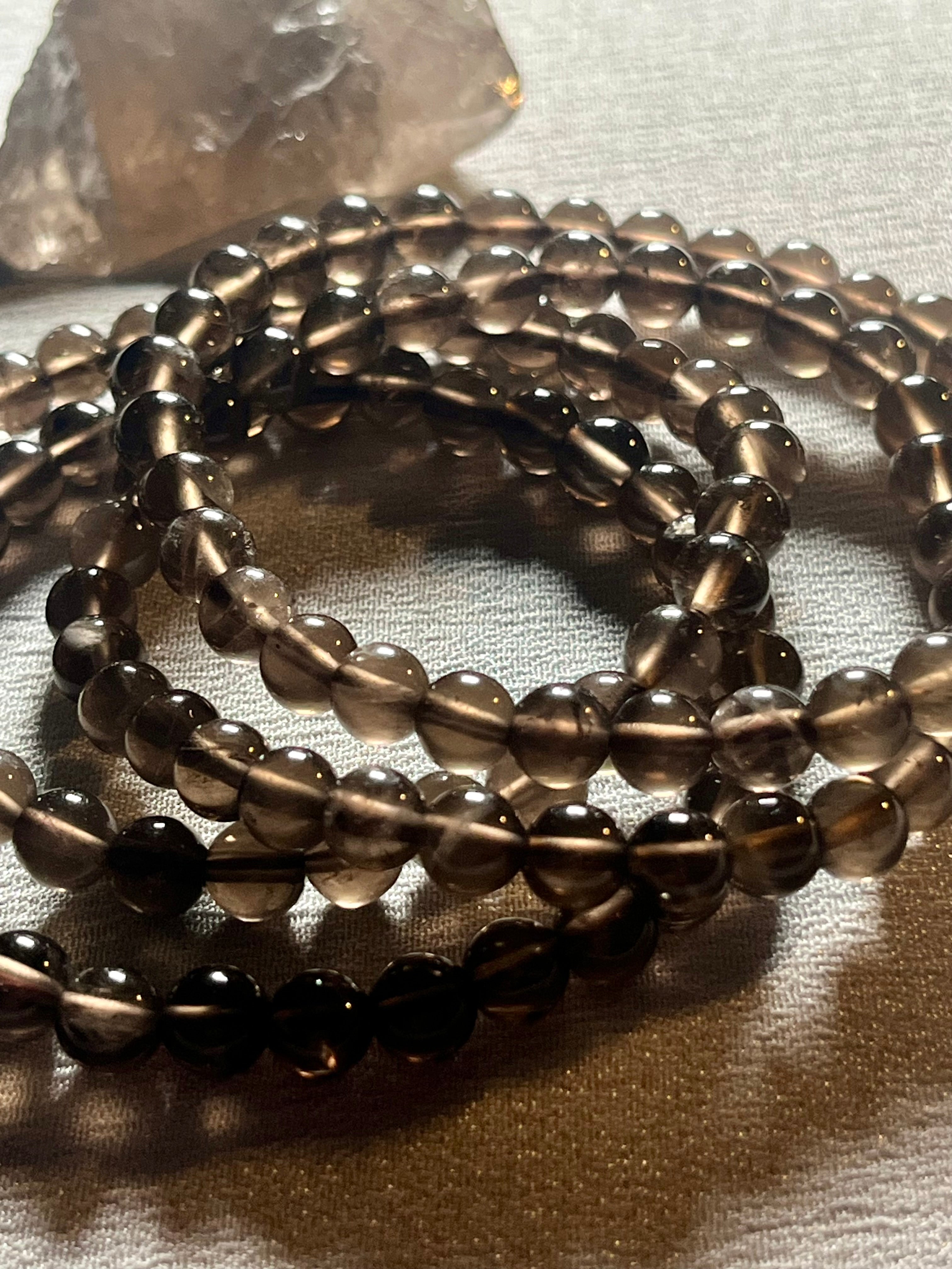 Smoky Quartz smooth round 6mm bead stretch bracelet (AA grade)