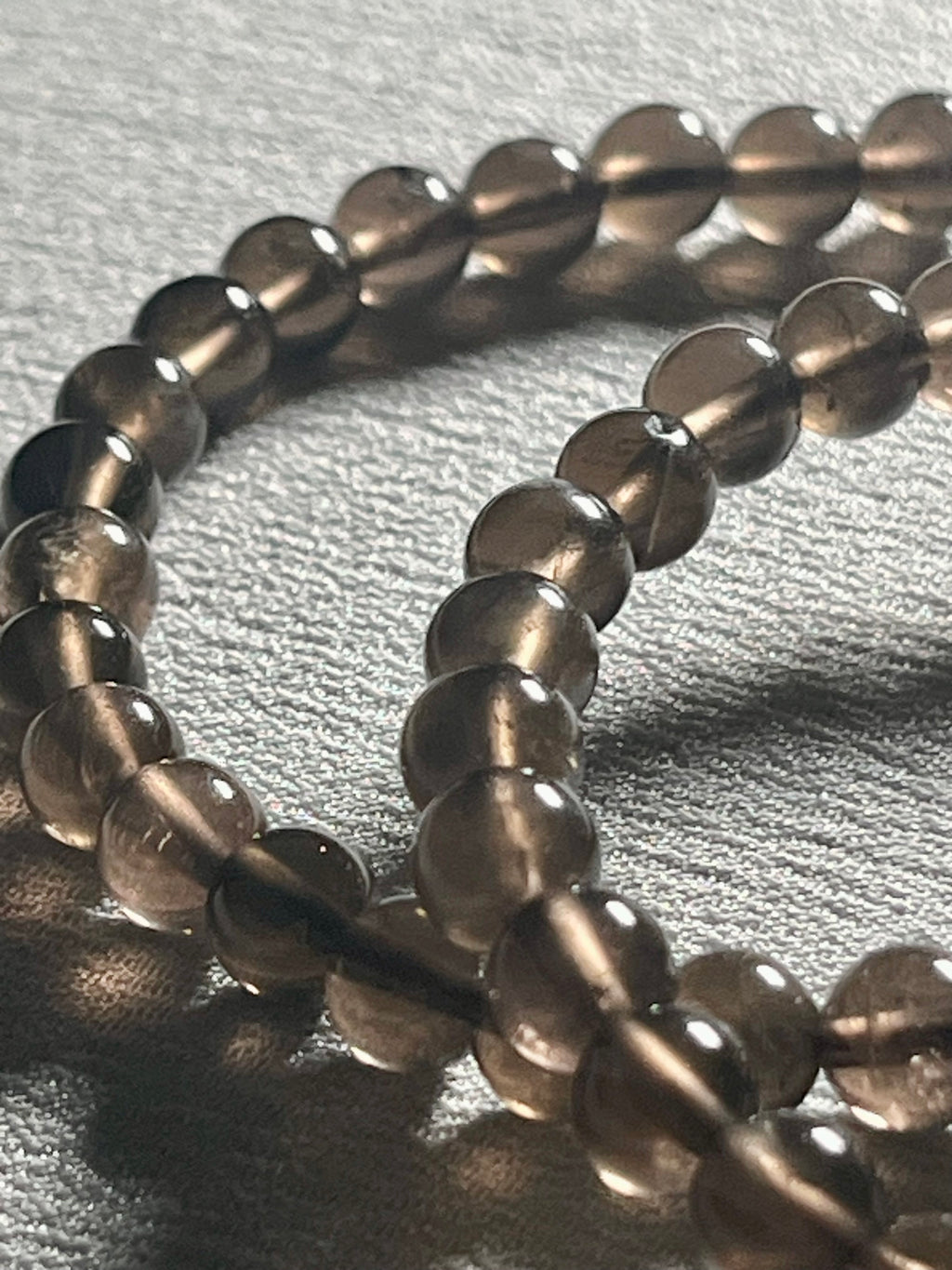 Smoky Quartz smooth round 6mm bead stretch bracelet (AA grade)