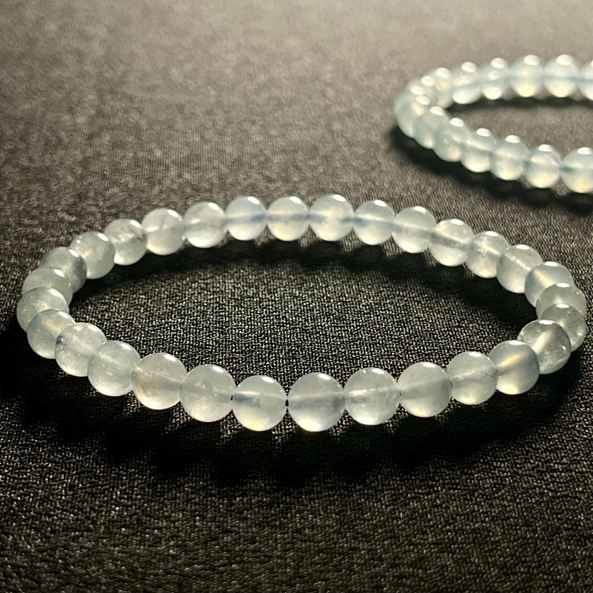 Aquamarine smooth round 6mm bead stretch bracelet; March birthstone