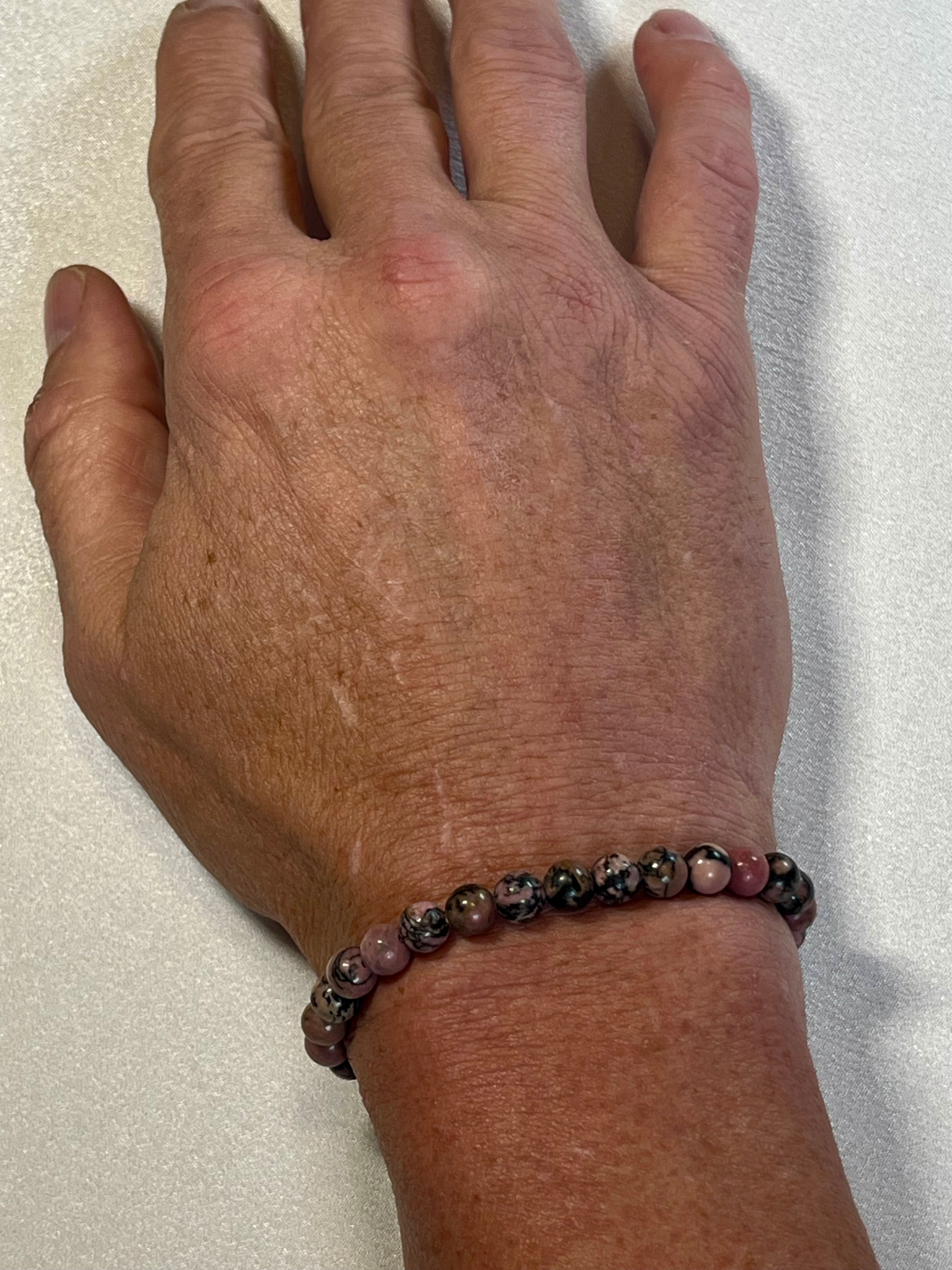 Rhodonite with black matrix smooth round 6mm bead stretch bracelet