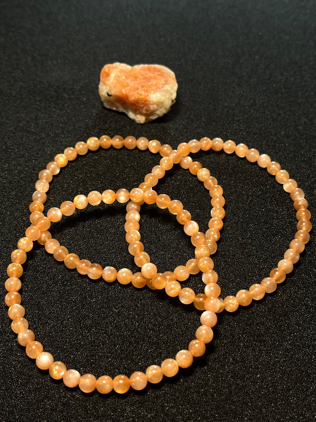 Sunstone w/ strong Moonstone-like adularescence smooth round 4mm bead stretch bracelets (premium grade)