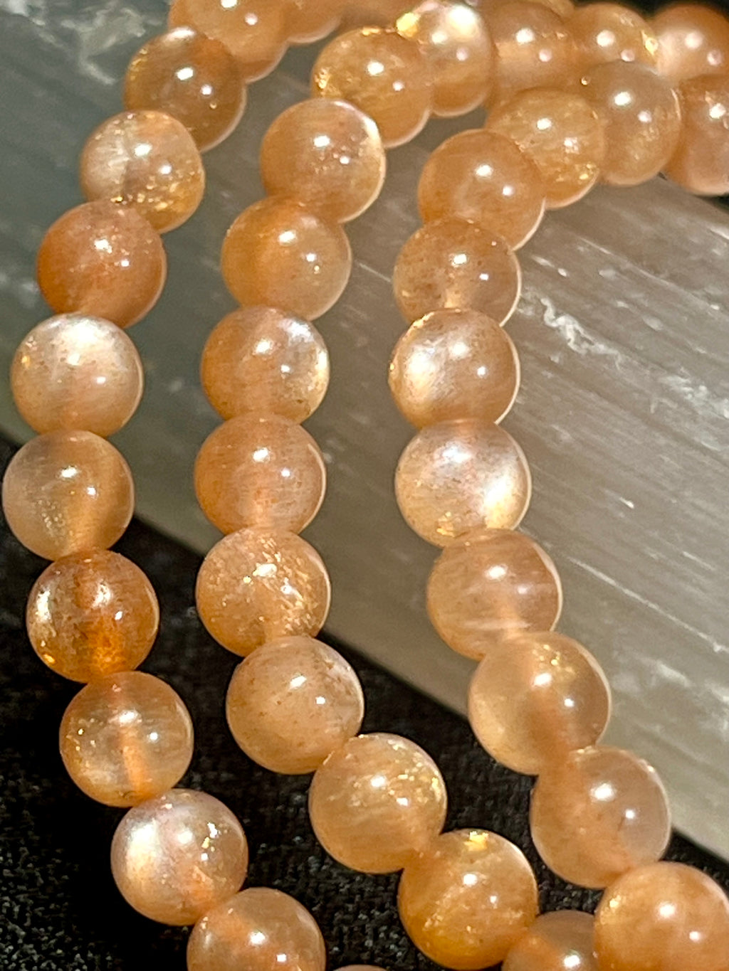 Sunstone w/ strong Moonstone-like adularescence smooth round 4mm bead stretch bracelets (premium grade)