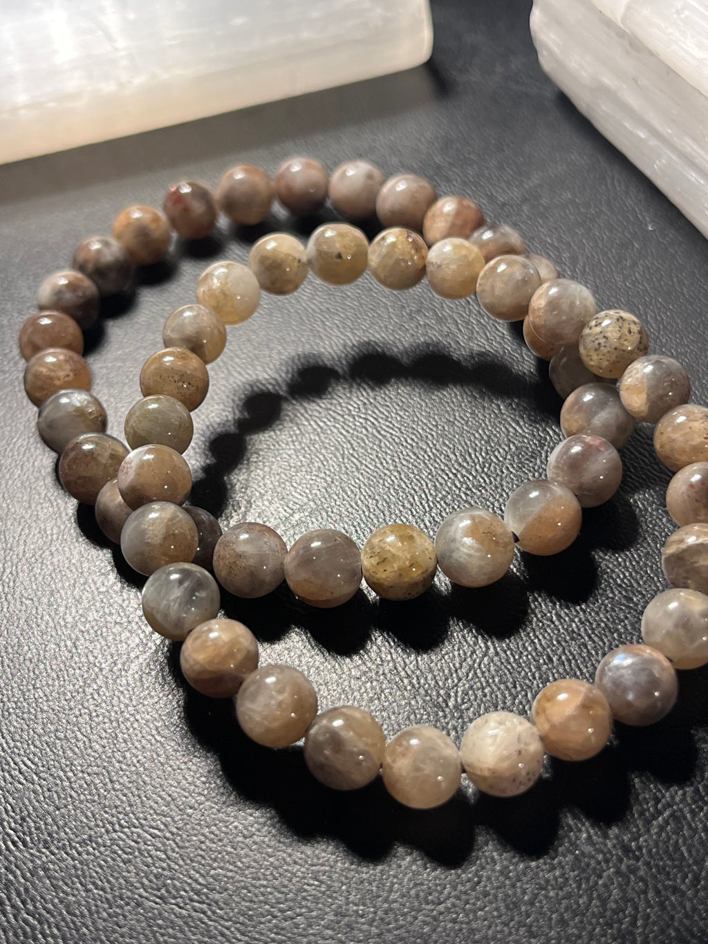 Black Sunstone smooth round 7mm bead stretch bracelet (AA grade)