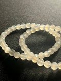 White Moonstone silver flash smooth round 6mm bead stretch bracelet (AA grade); alternative June birthstone