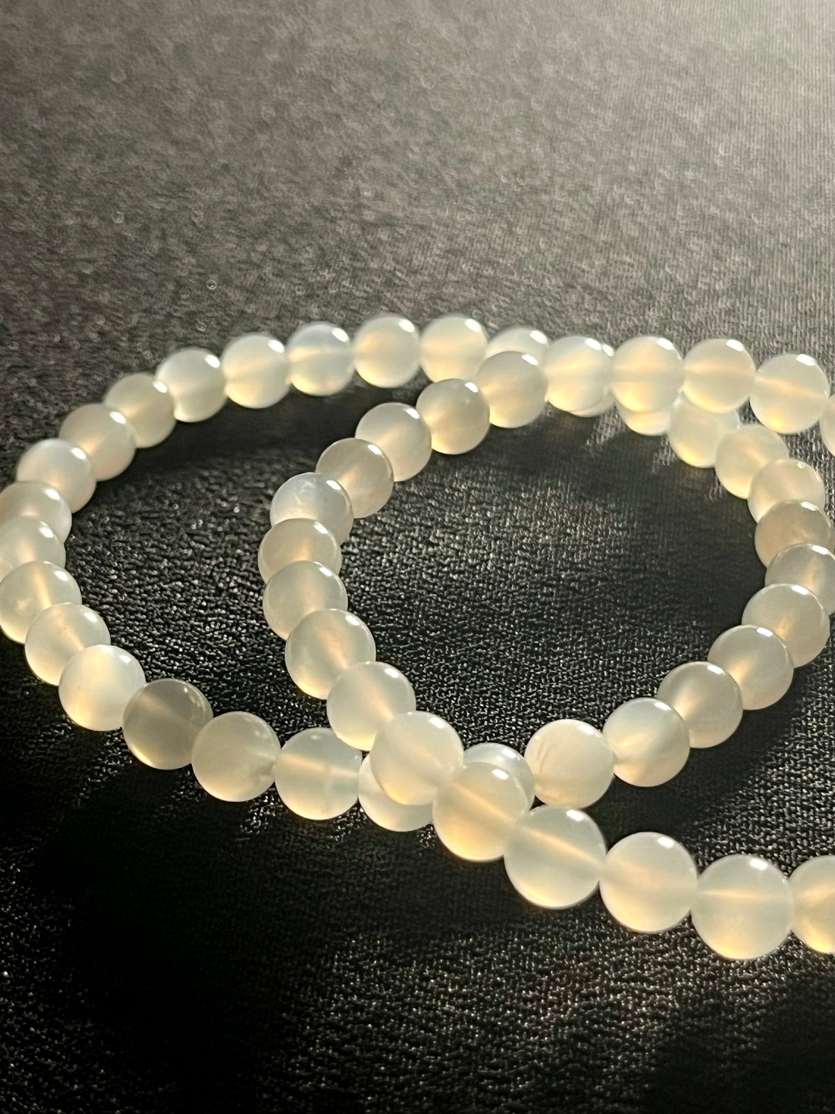 White Moonstone silver flash smooth round 6mm bead stretch bracelet (AA grade); alternative June birthstone