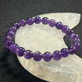Amethyst smooth round 8mm bead stretch bracelet; February birthstone