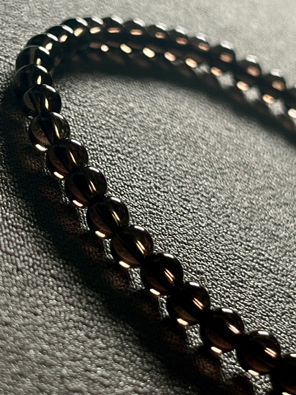Smoky Quartz smooth round 4mm bead stretch bracelet (premium grade)