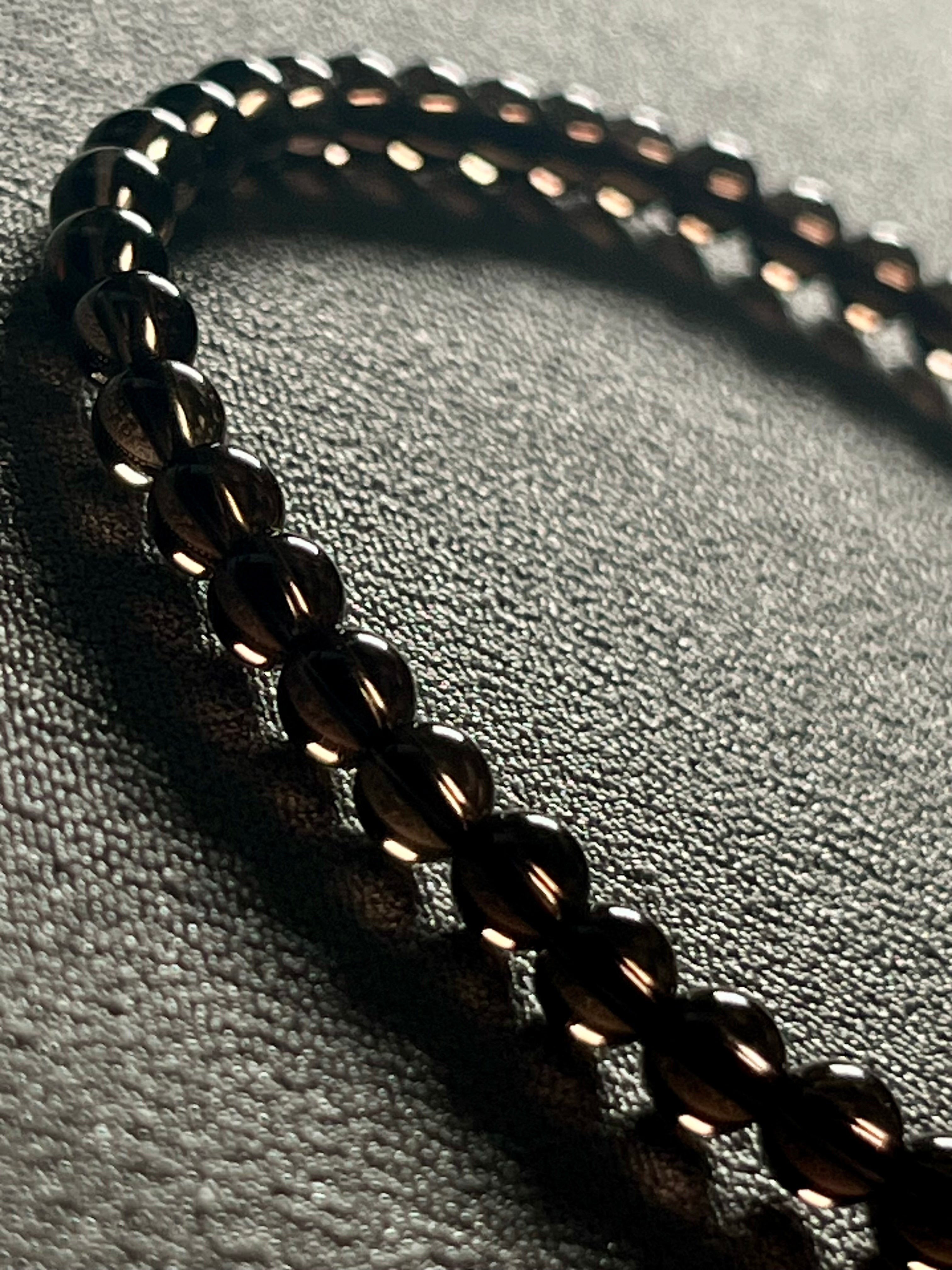Smoky Quartz smooth round 4mm bead stretch bracelet (premium grade)