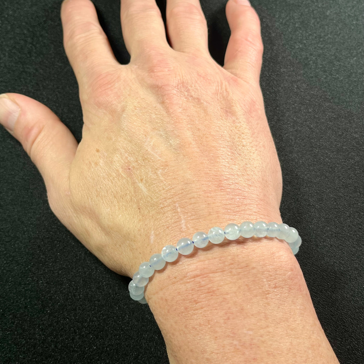 Aquamarine smooth round 6mm bead stretch bracelet; March birthstone
