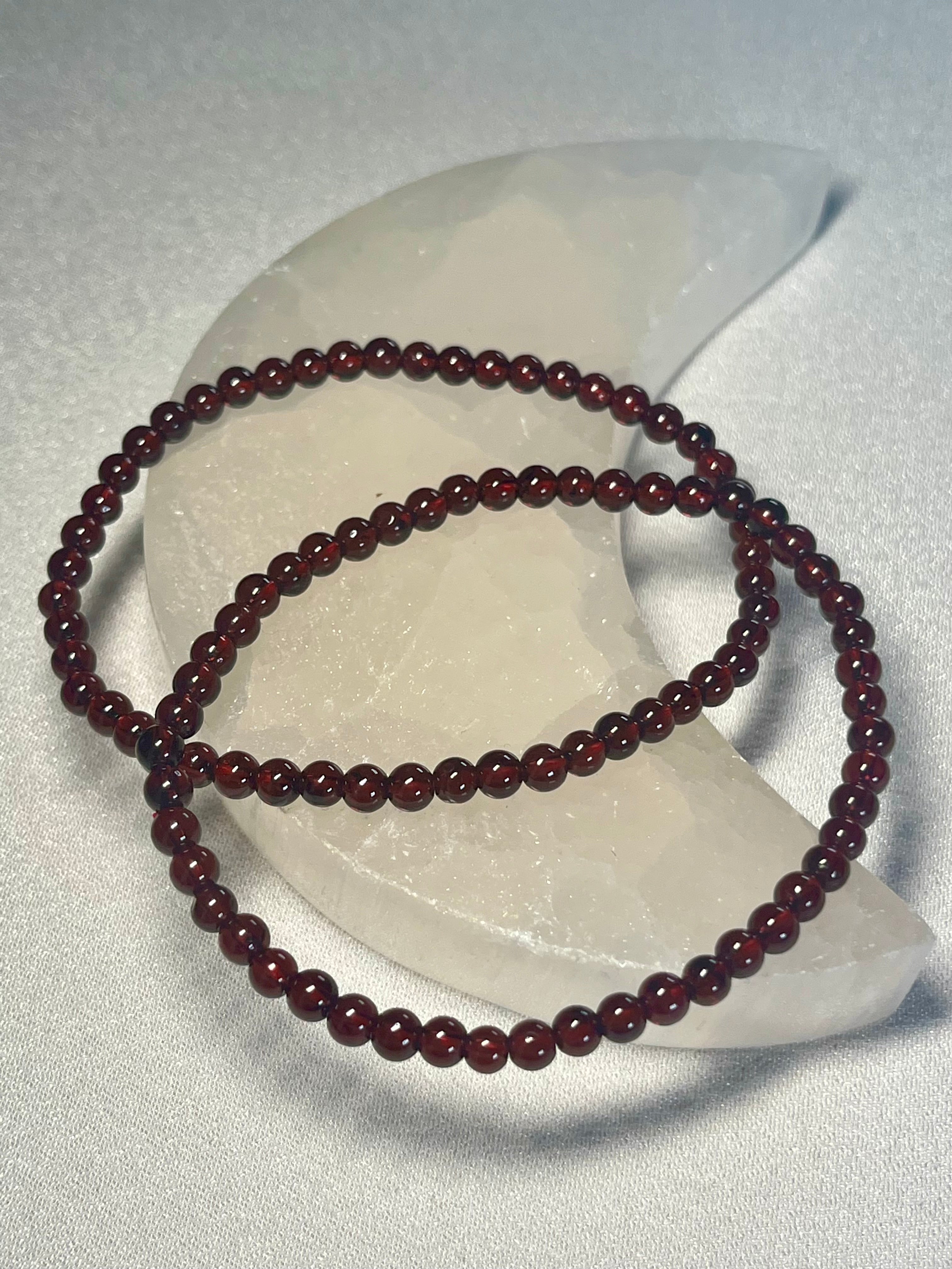Red Garnet smooth round 4mm stretch bracelet (AA grade); January birthstone