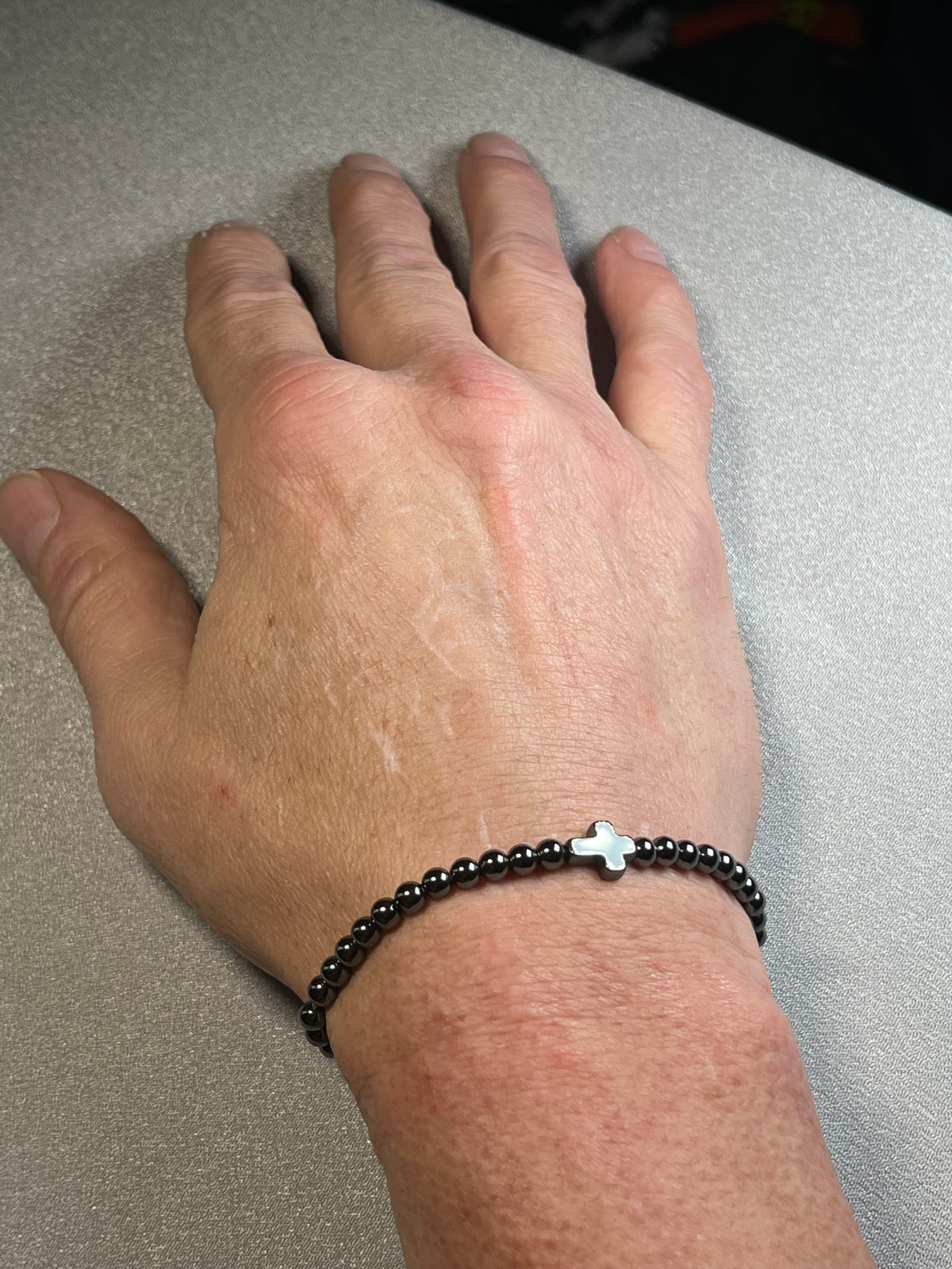 Hematite smooth round 4mm and 6mm bead stretch bracelets w/ Hematite Christian cross focal beads