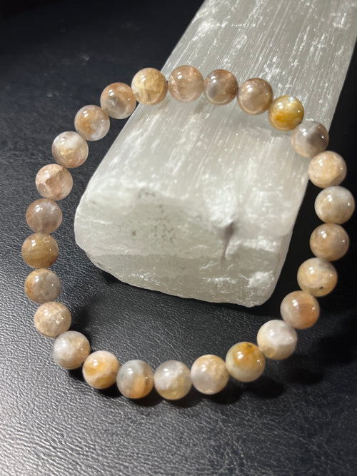 Black Sunstone smooth round 7mm bead stretch bracelet (AA grade)