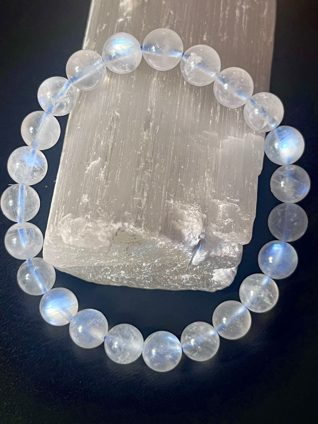 Blue Moonstone smooth round 8mm high-clarity blue flash bead stretch bracelet; June birthstone