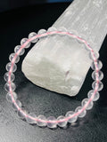 Light Pink Mozambique Rose Quartz smooth round 6.5mm bead stretch bracelet (AAA grade); October birthstone