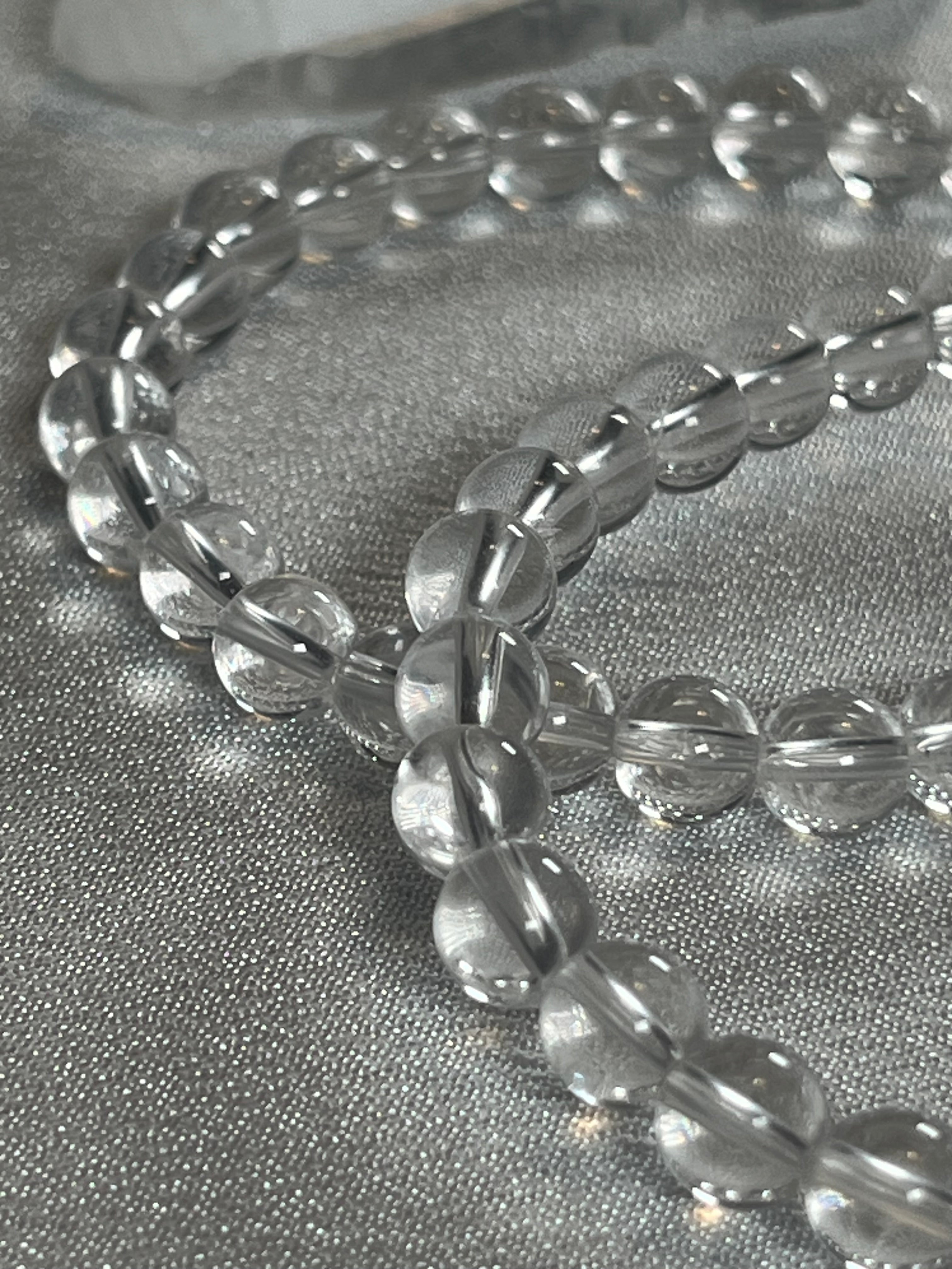 Clear Crystal Quartz smooth round 4mm, 6mm bead stretch bracelet (premium)