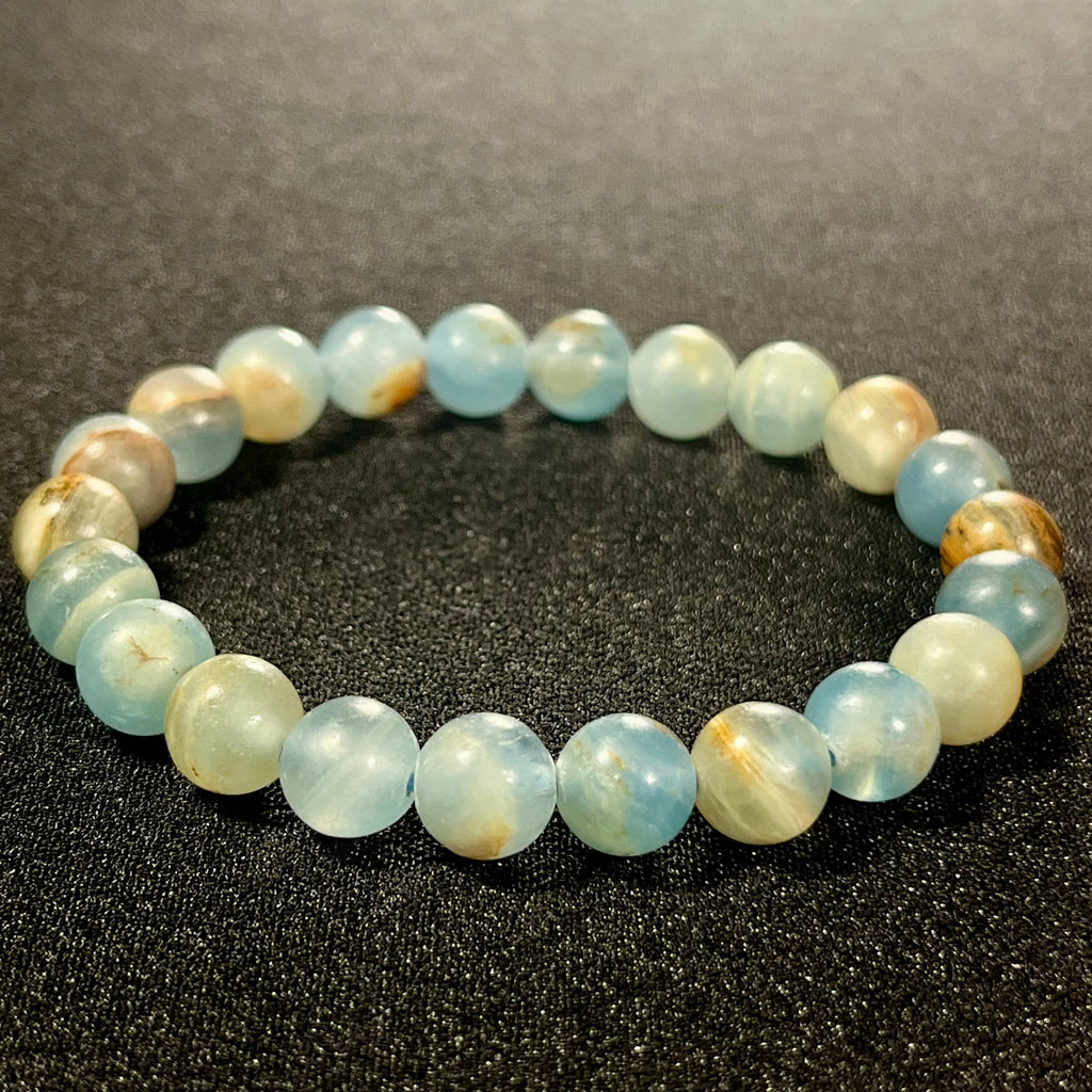 Argentina Blue Calcite smooth round 8mm bead stretch bracelet (AAA grade)