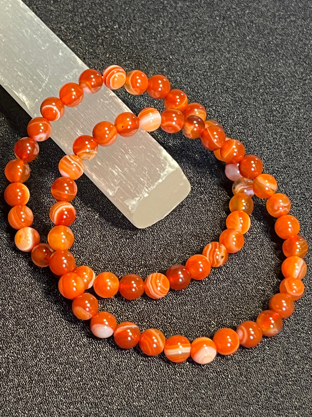 Carnelian (dark orange) smooth round 6mm bead stretch bracelet; July birthstone