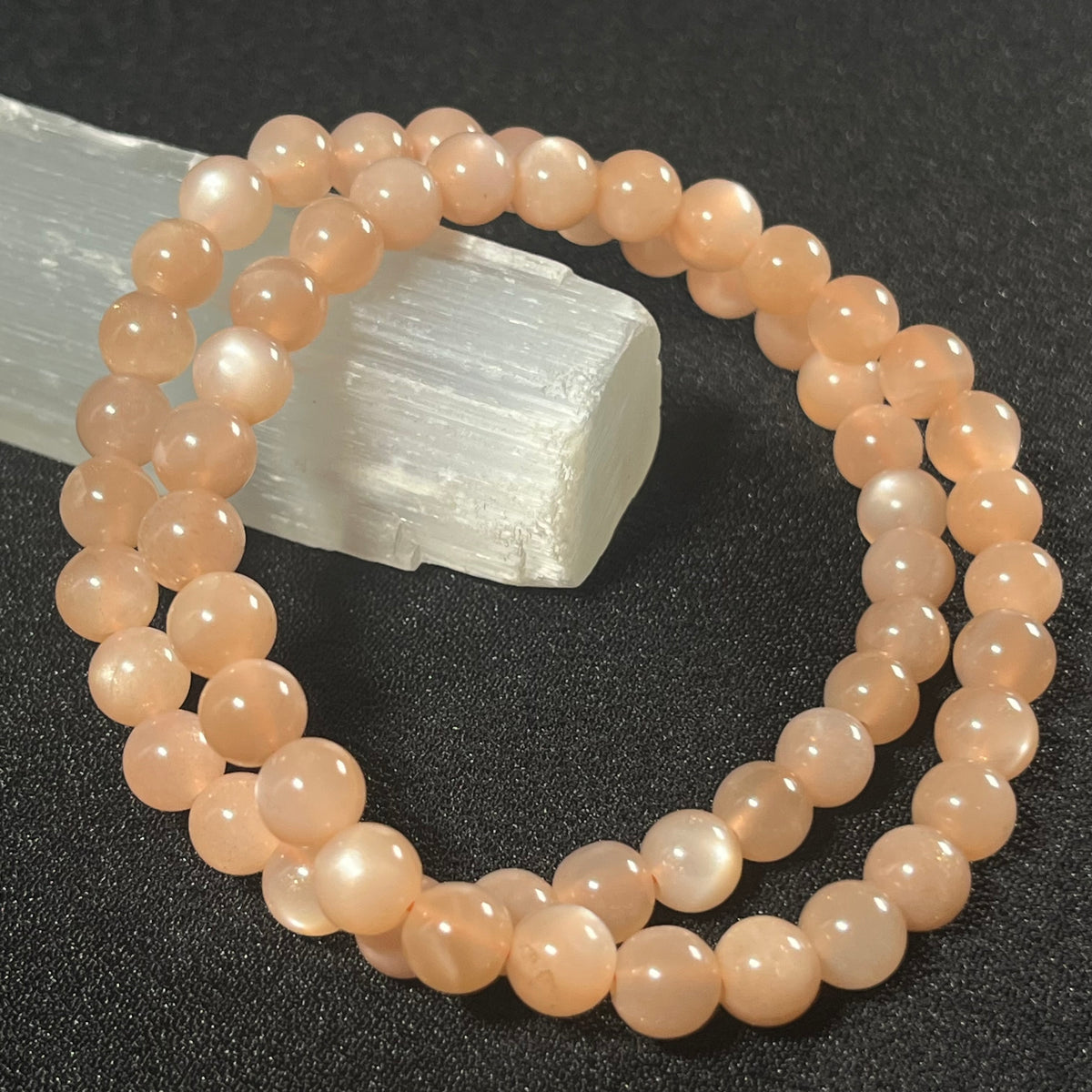 Peach Moonstone (w/ strong flash) smooth round 6mm bead stretch bracelet; June birthstone