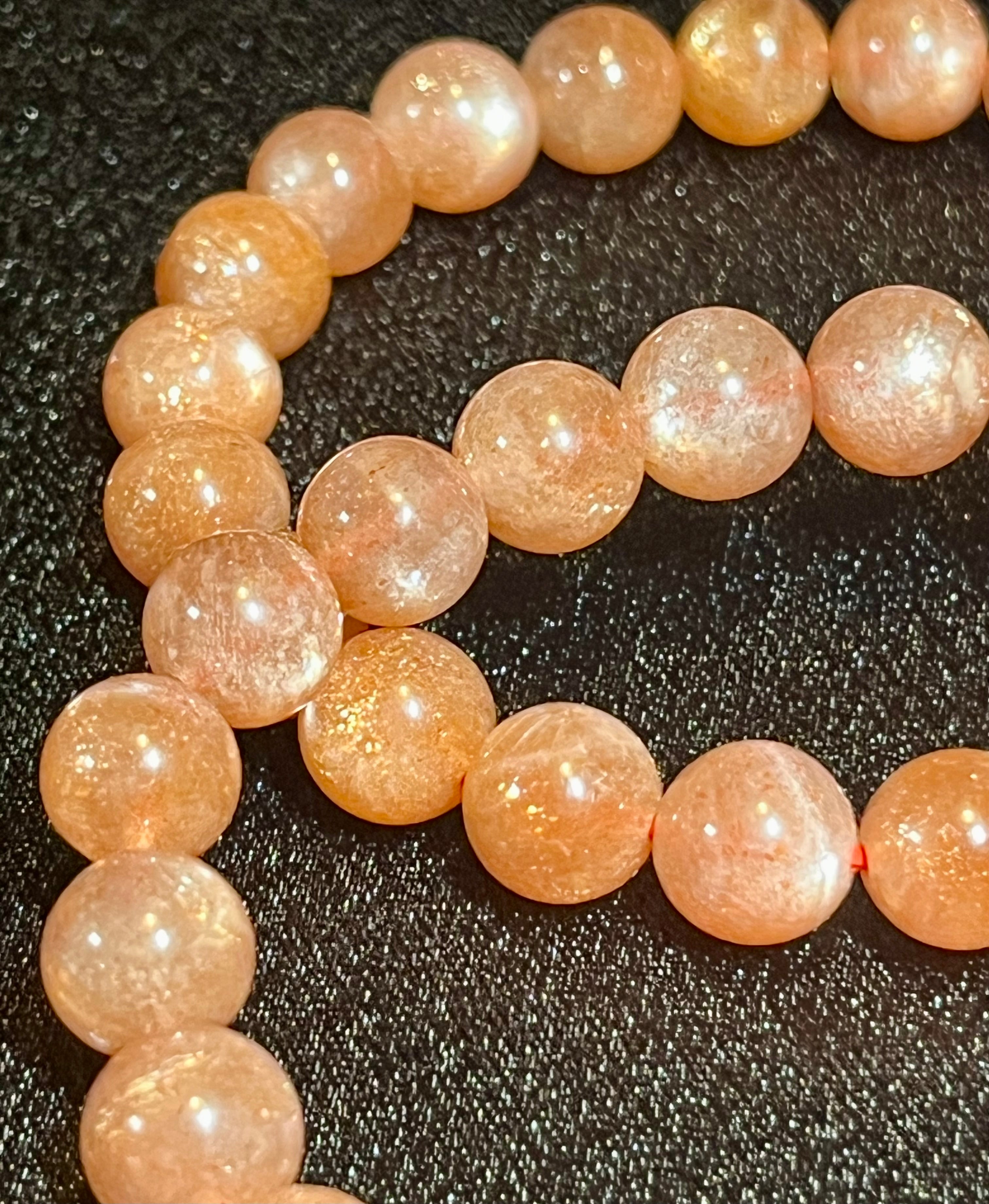 Sunstone w/ Moonstone adularescence flash smooth round 8mm bead stretch bracelet (AAA grade)