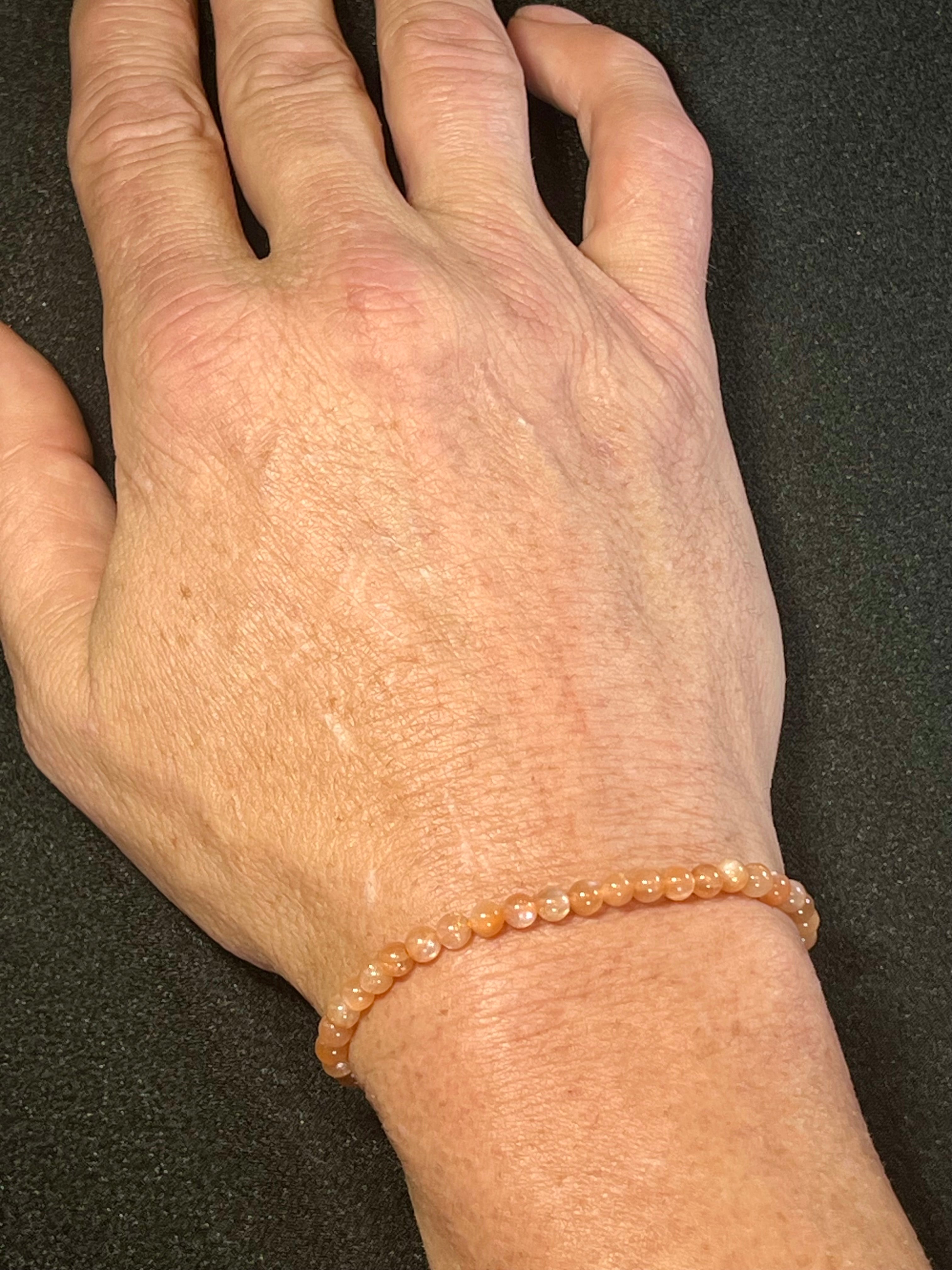 Sunstone w/ strong Moonstone-like adularescence smooth round 4mm bead stretch bracelets (premium grade)