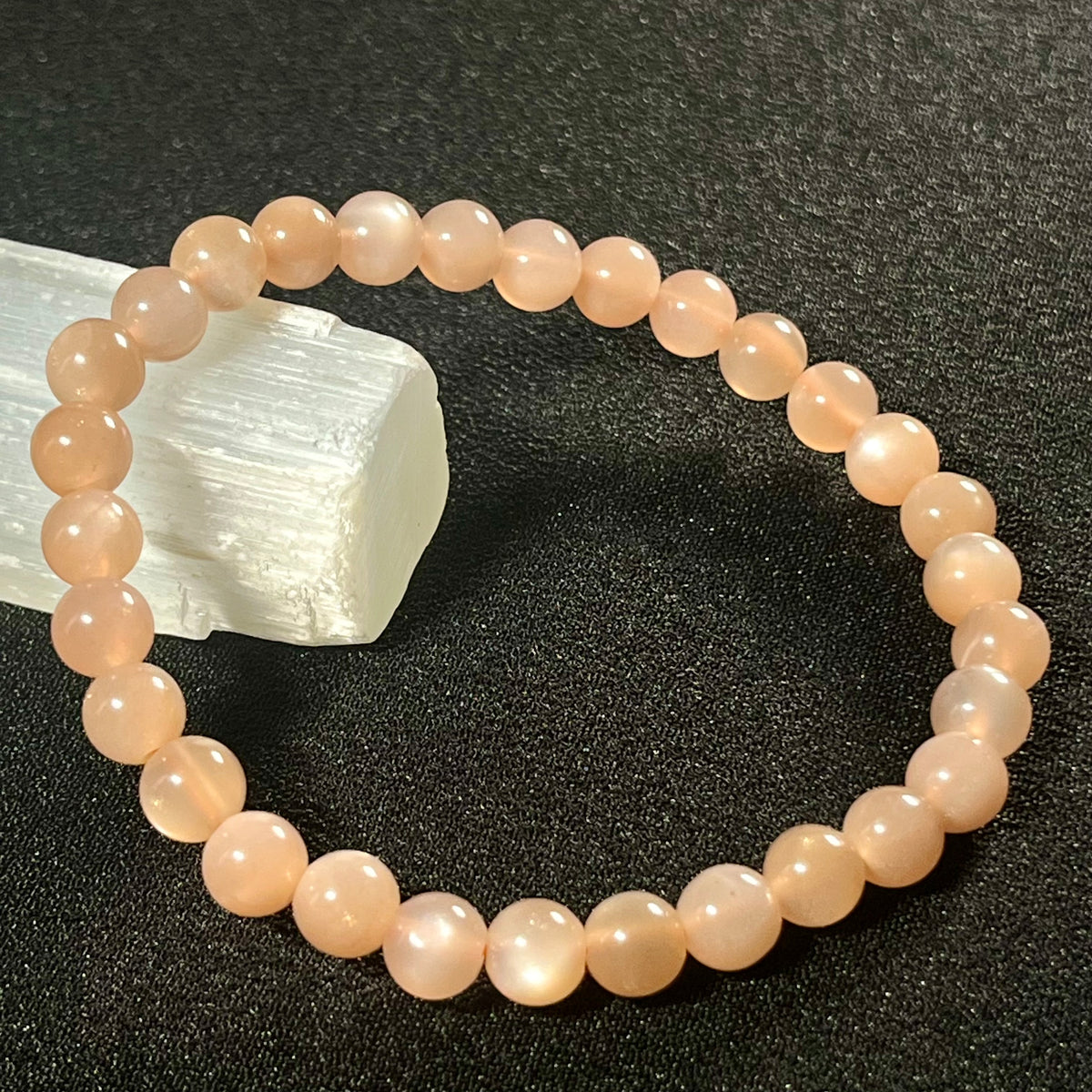 Peach Moonstone (w/ strong flash) smooth round 6mm bead stretch bracelet; June birthstone