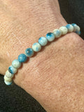 Blue Ice (Glacierite)smooth round 6mm bead stretch bracelet (A grade)