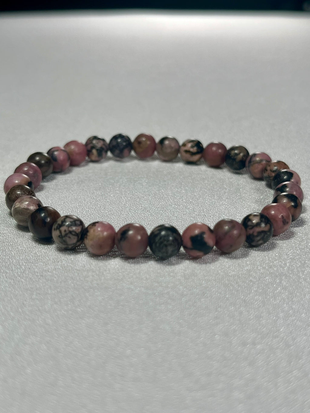 Rhodonite with black matrix smooth round 6mm bead stretch bracelet