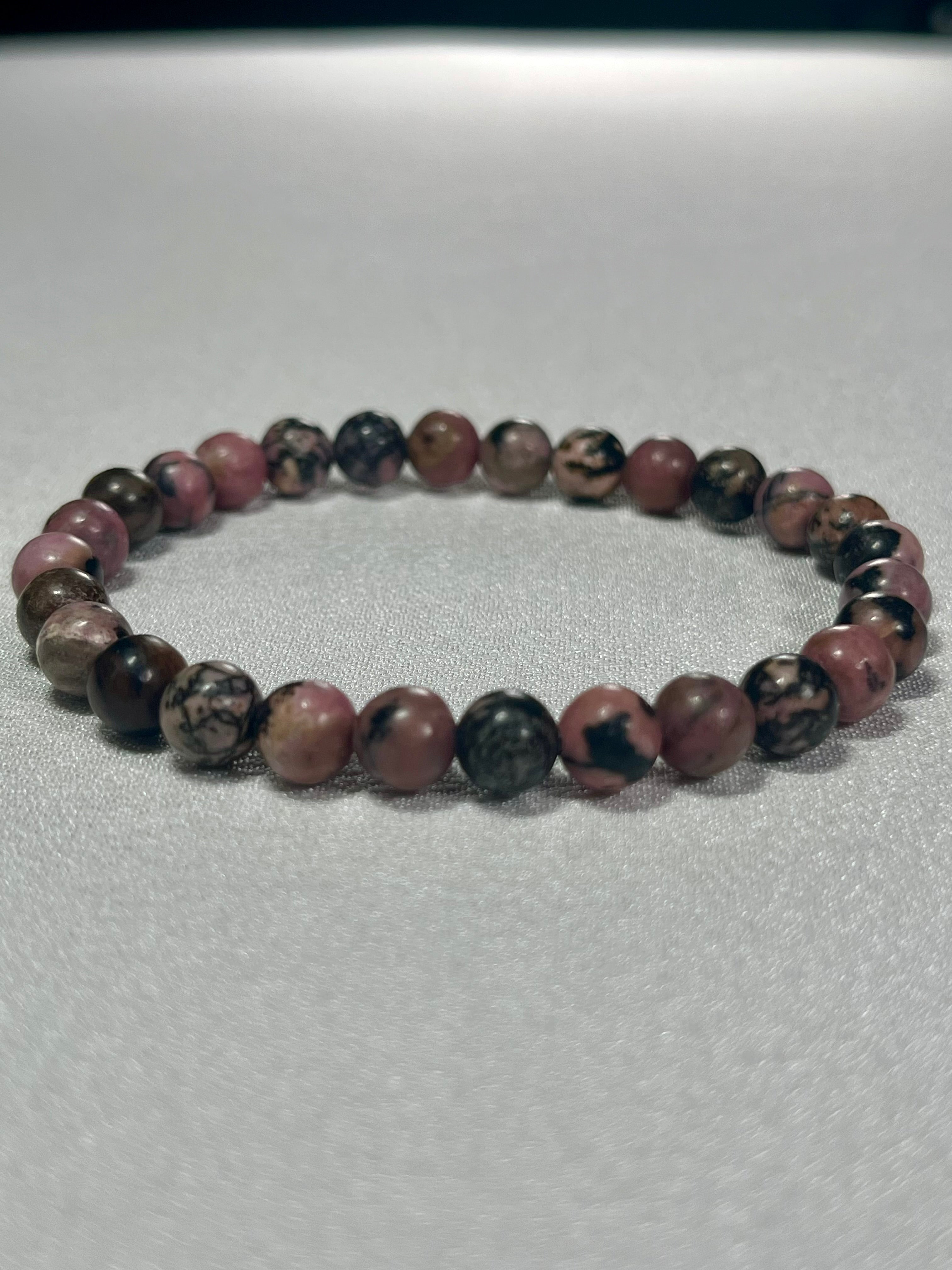 Rhodonite with black matrix smooth round 6mm bead stretch bracelet