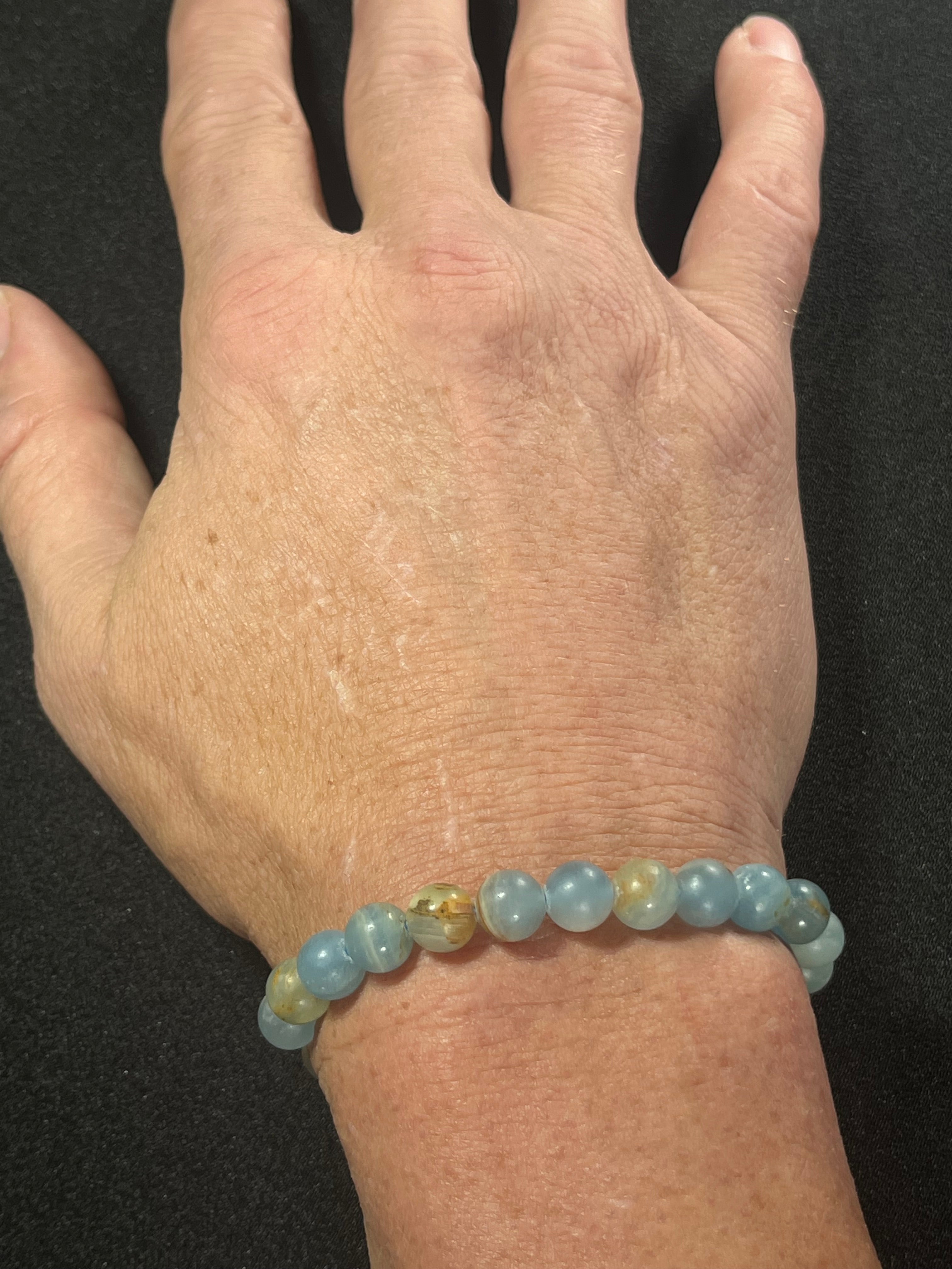 Argentina Blue Calcite smooth round 8mm bead stretch bracelet (AAA grade)