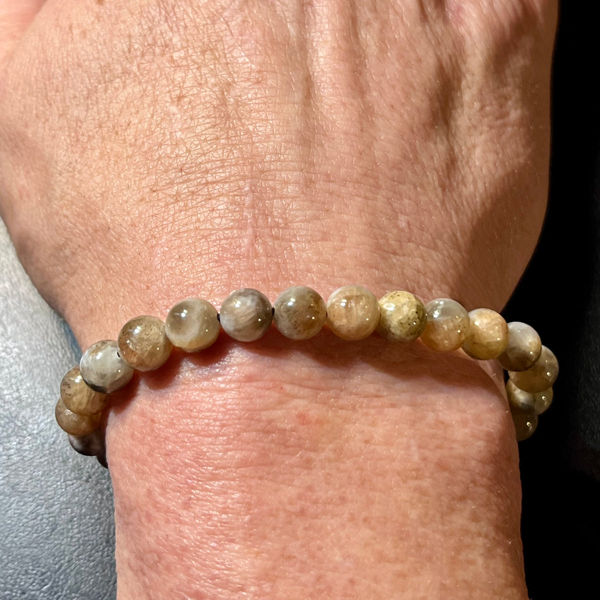 Black Sunstone smooth round 7mm bead stretch bracelet (AA grade)