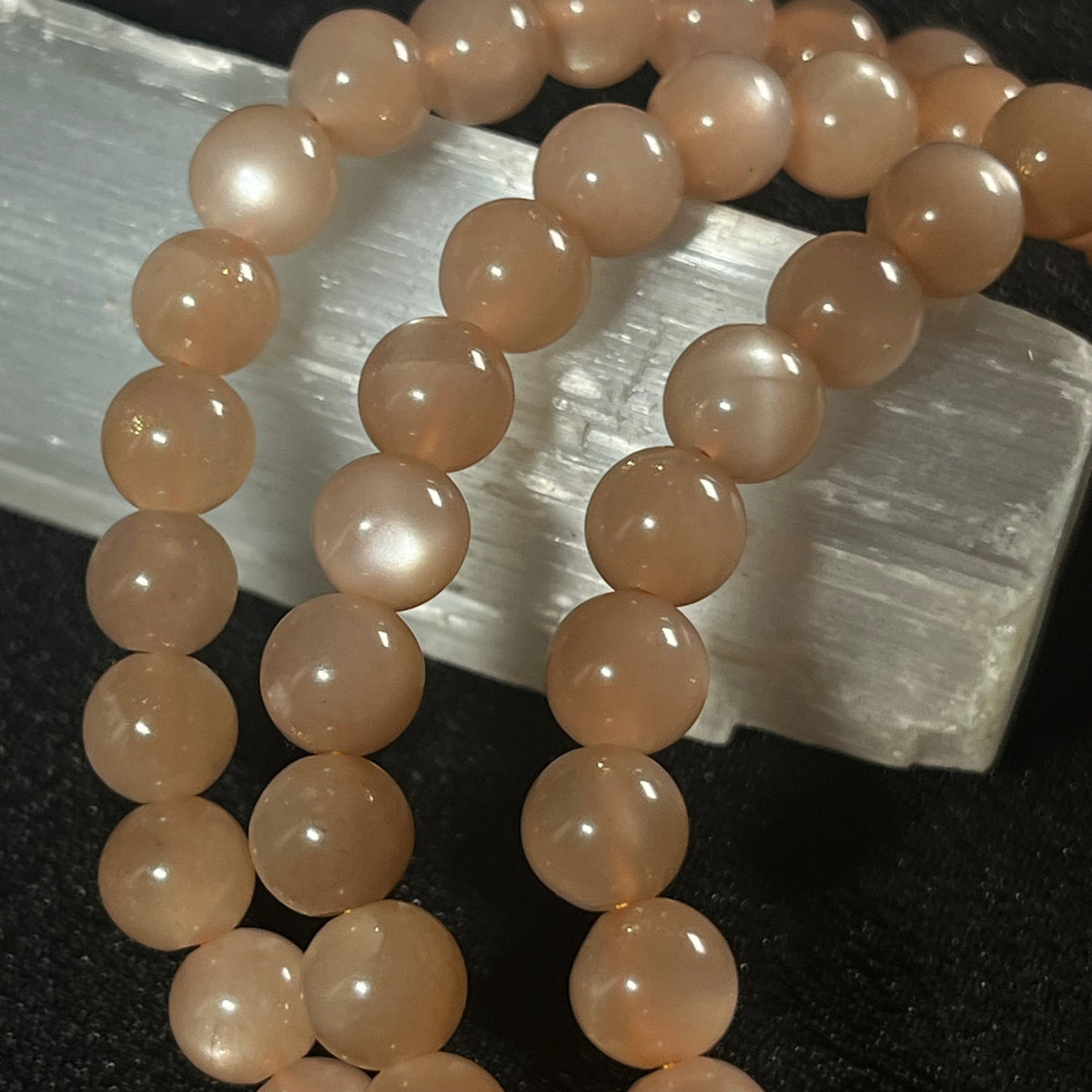 Peach Moonstone (w/ strong flash) smooth round 6mm bead stretch bracelet; June birthstone