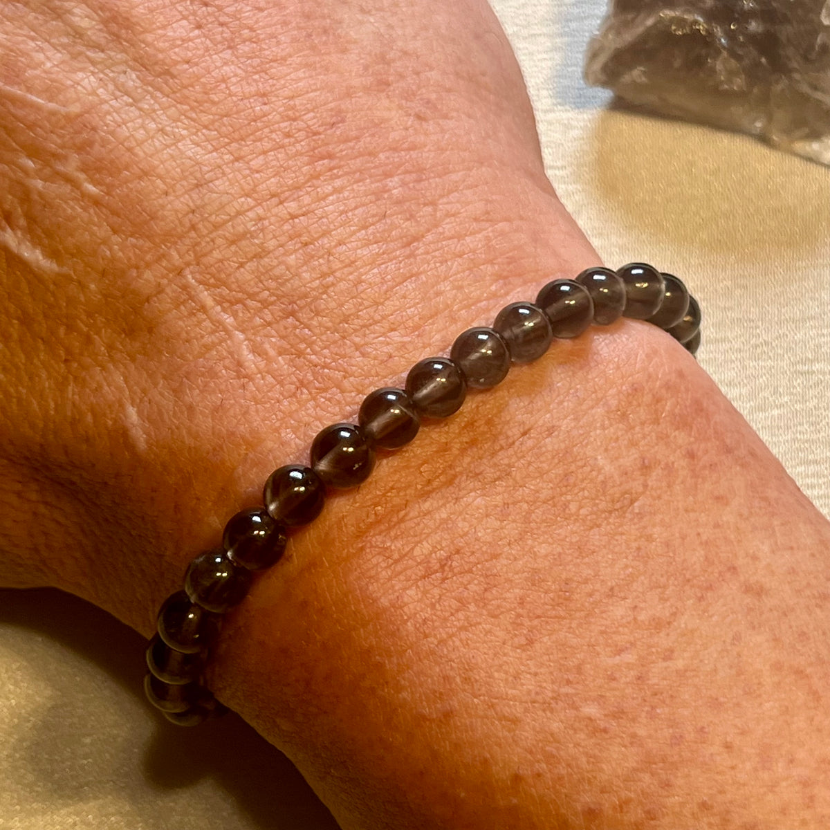 Smoky Quartz smooth round 6mm bead stretch bracelet (AA grade)