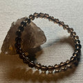 Smoky Quartz smooth round 6mm bead stretch bracelet (AA grade)