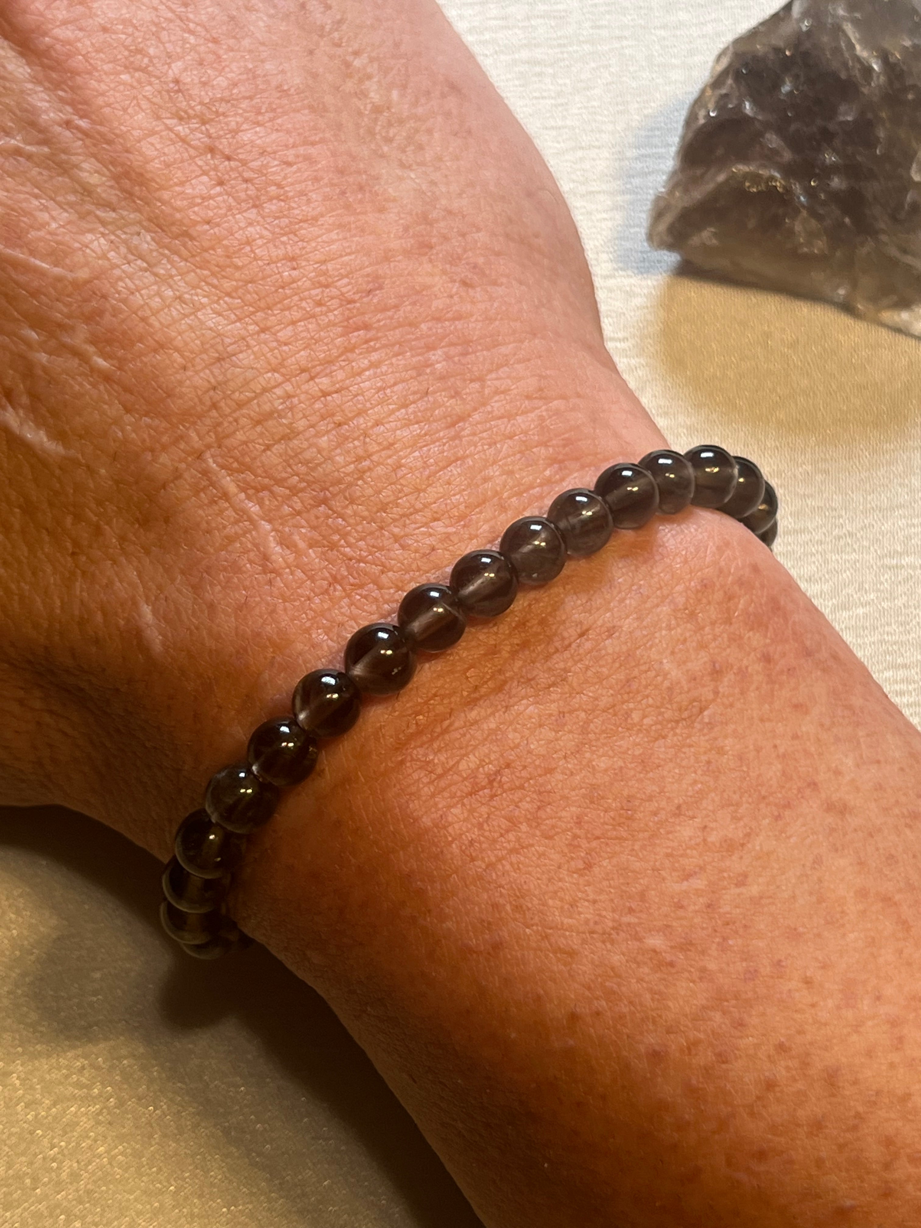 Smoky Quartz smooth round 6mm bead stretch bracelet (AA grade)