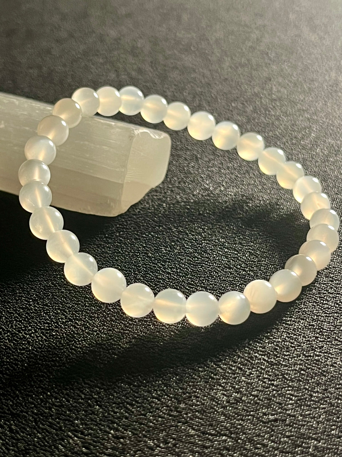 White Moonstone silver flash smooth round 6mm bead stretch bracelet (AA grade); alternative June birthstone