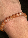 Sunstone w/ Moonstone adularescence flash smooth round 8mm bead stretch bracelet (AAA grade)