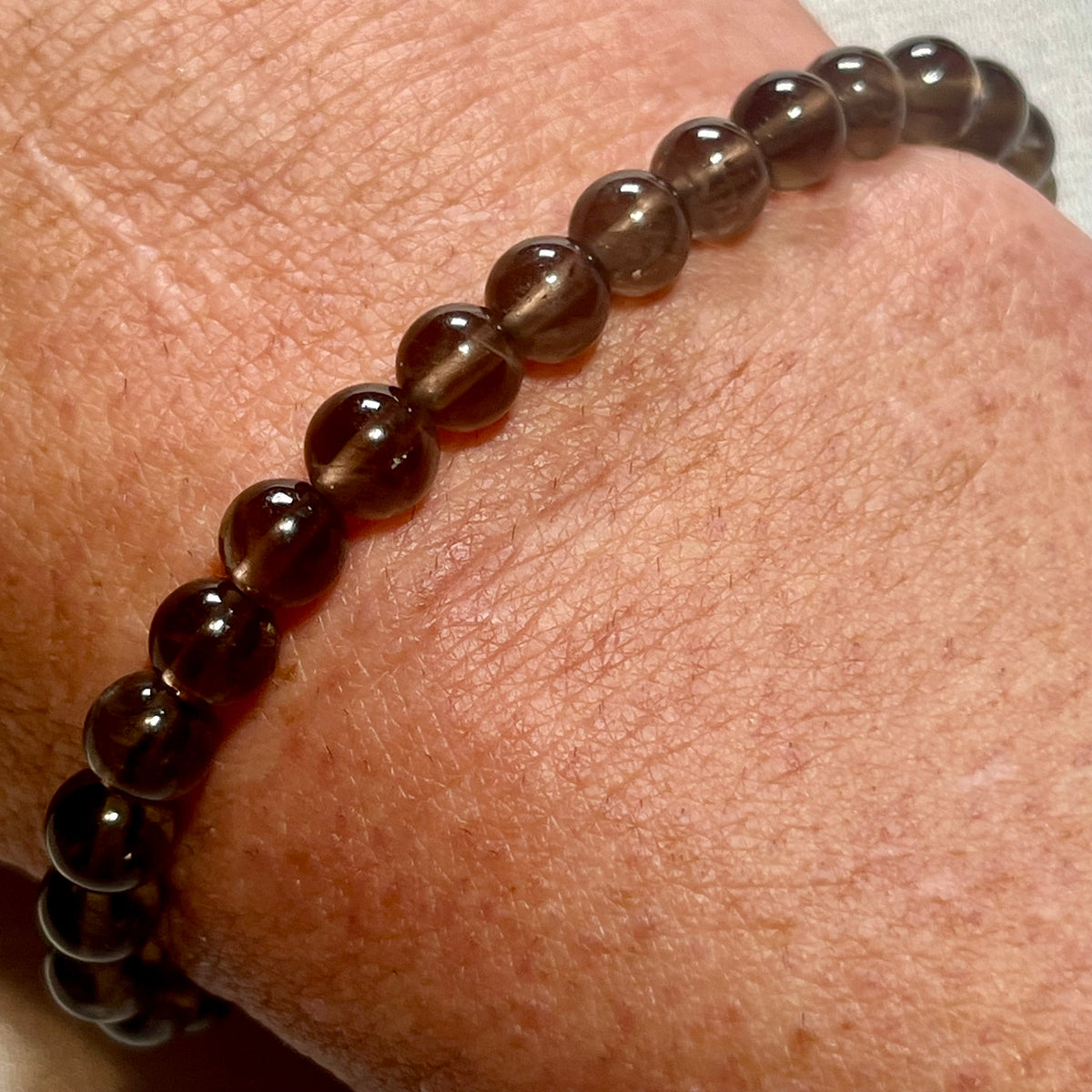 Smoky Quartz smooth round 6mm bead stretch bracelet (AA grade)