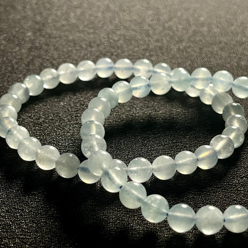 Aquamarine smooth round 6mm bead stretch bracelet; March birthstone