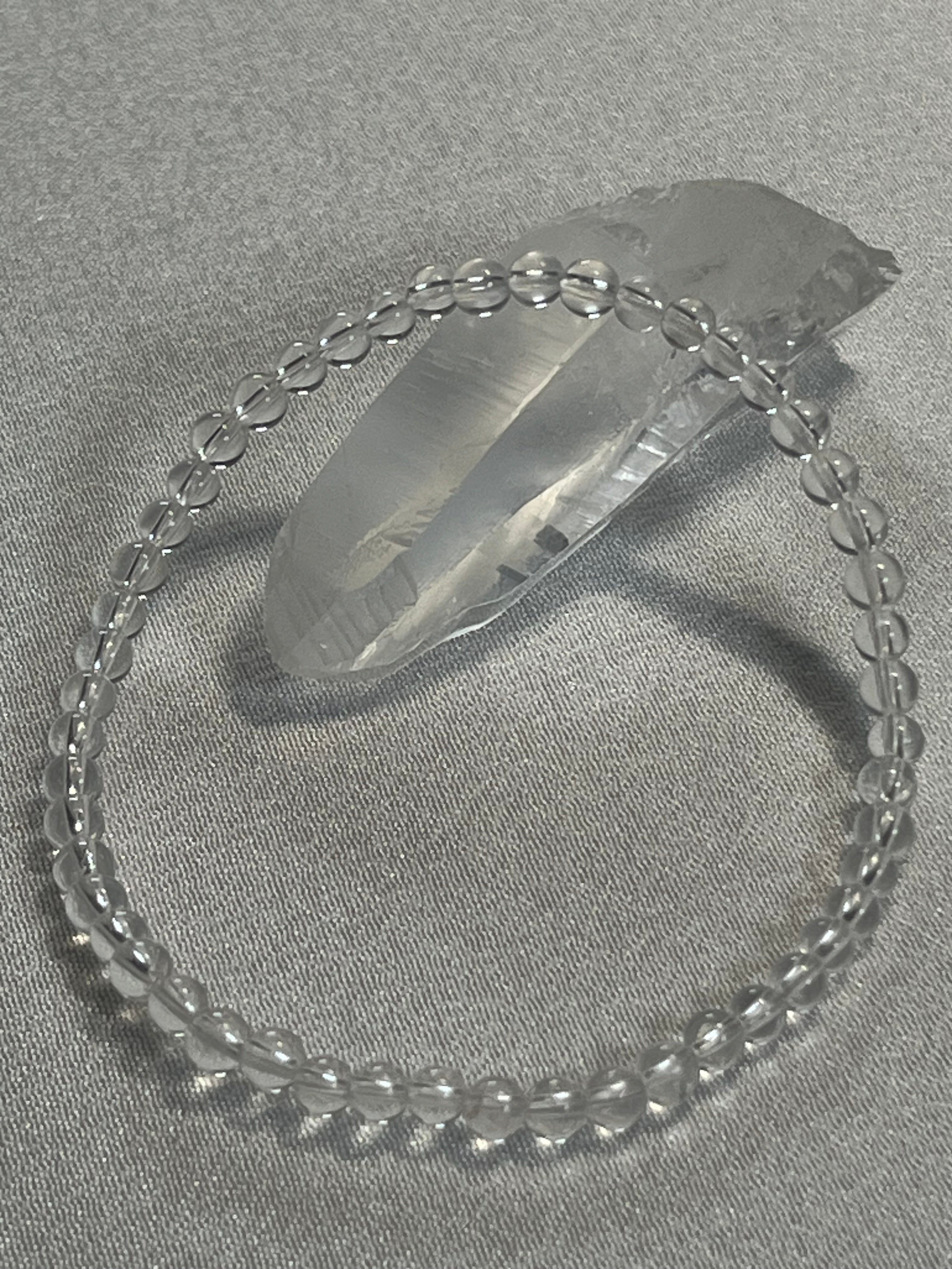 Clear Crystal Quartz smooth round 4mm, 6mm bead stretch bracelet (premium)
