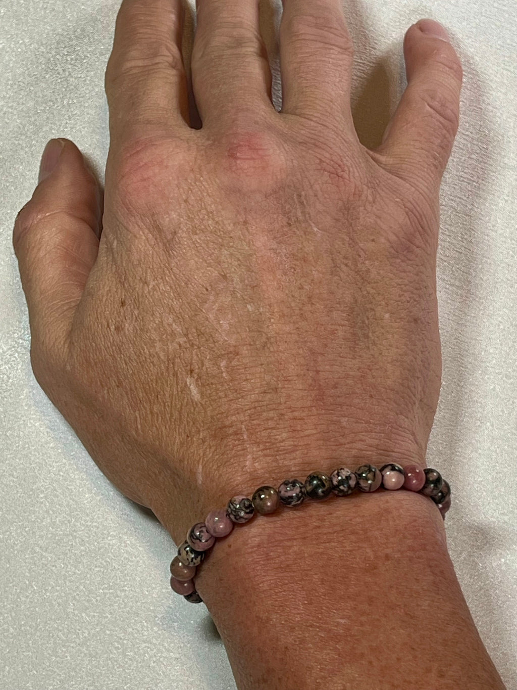 Rhodonite with black matrix smooth round 6mm bead stretch bracelet