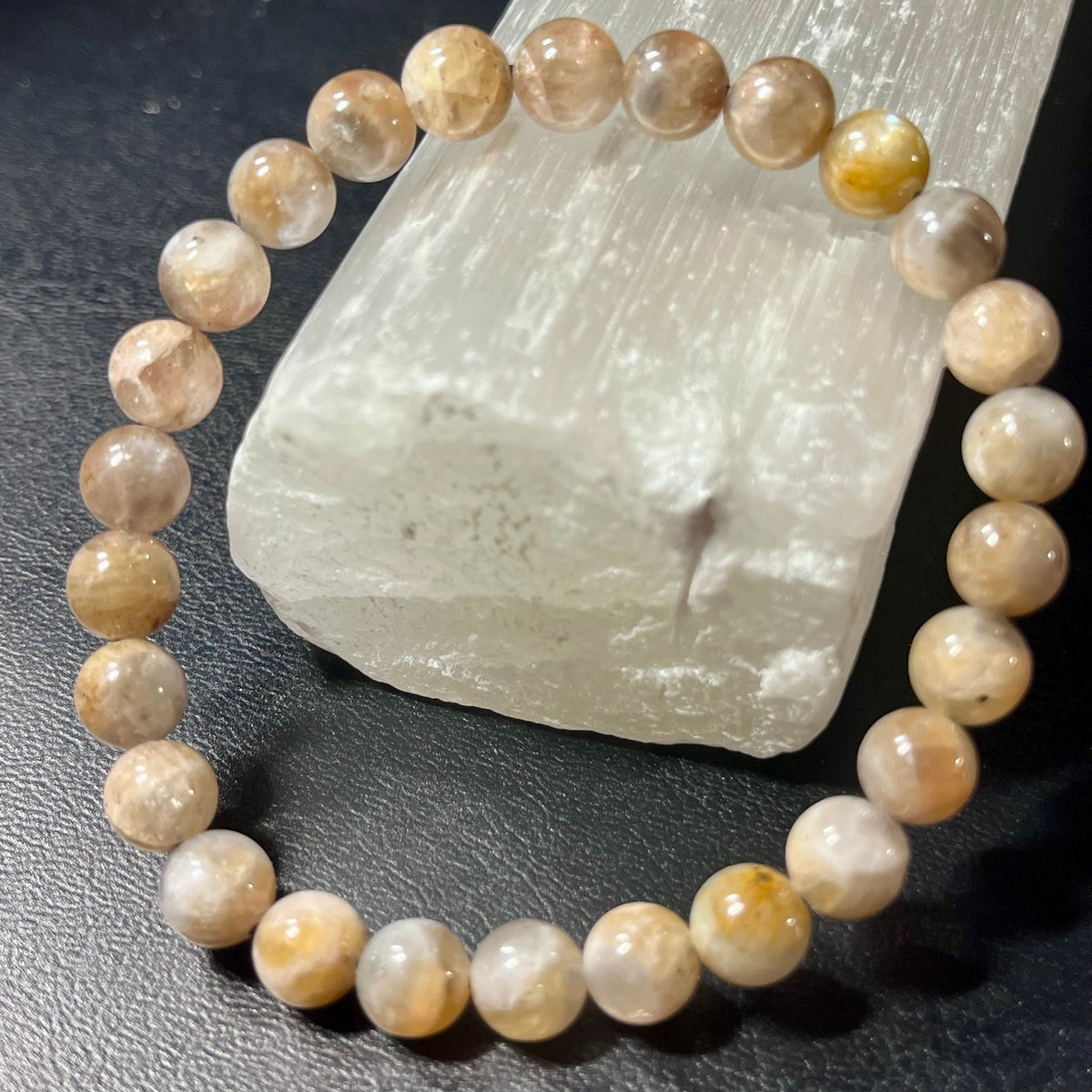 Black Sunstone smooth round 7mm bead stretch bracelet (AA grade)