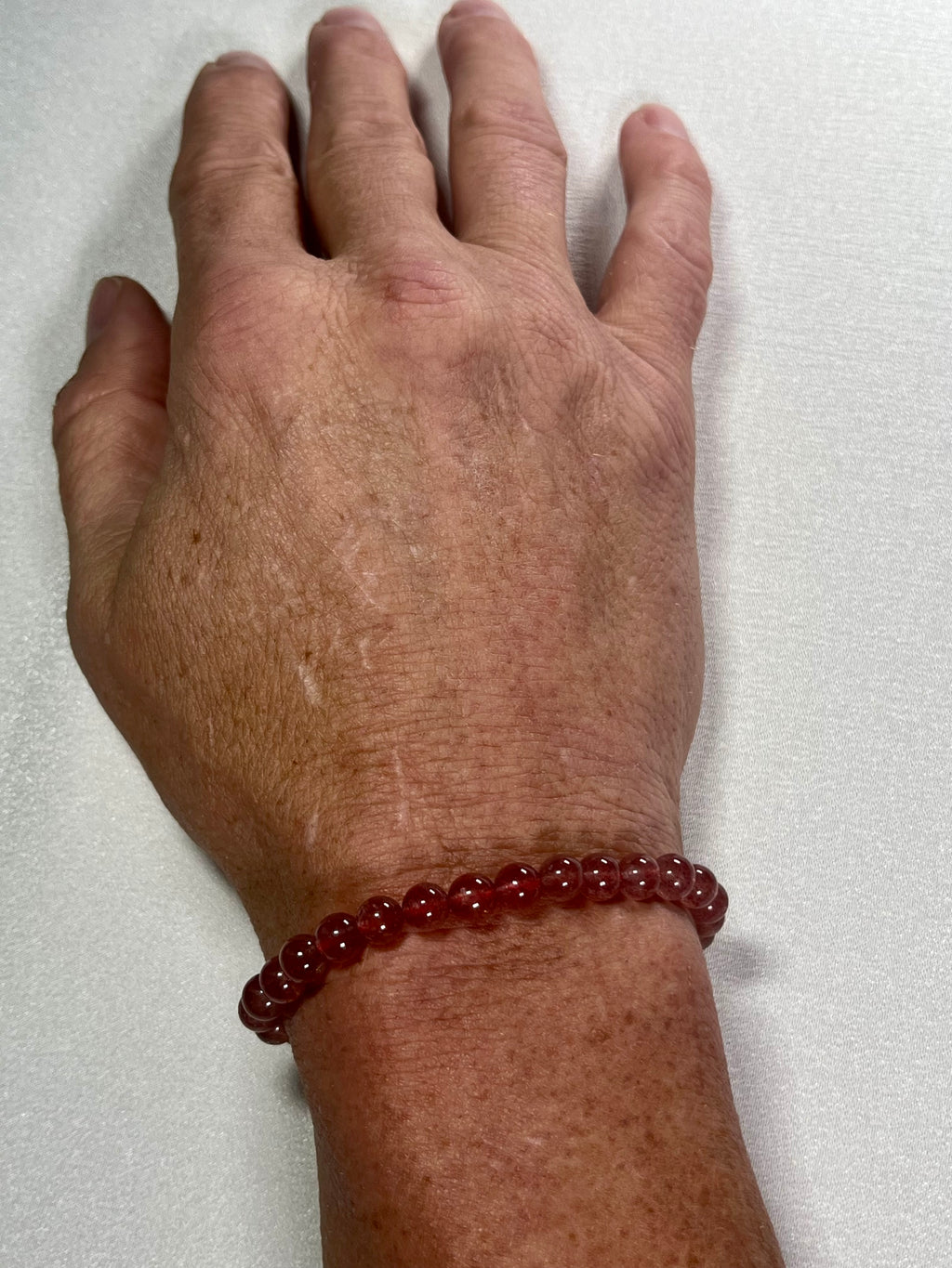 Strawberry Quartz smooth round 6mm bead stretch bracelet (AA grade)
