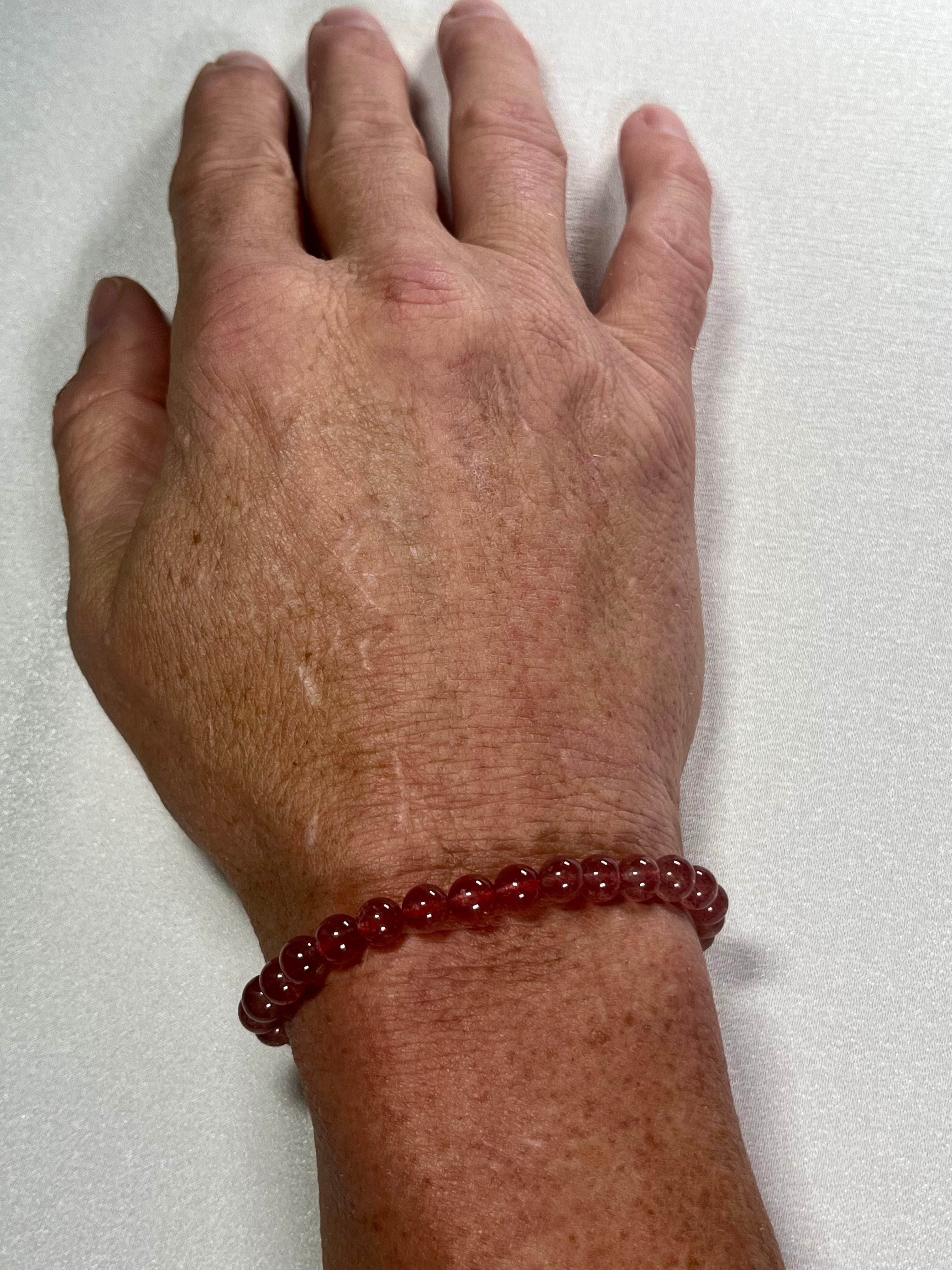 Strawberry Quartz smooth round 6mm bead stretch bracelet (AA grade)