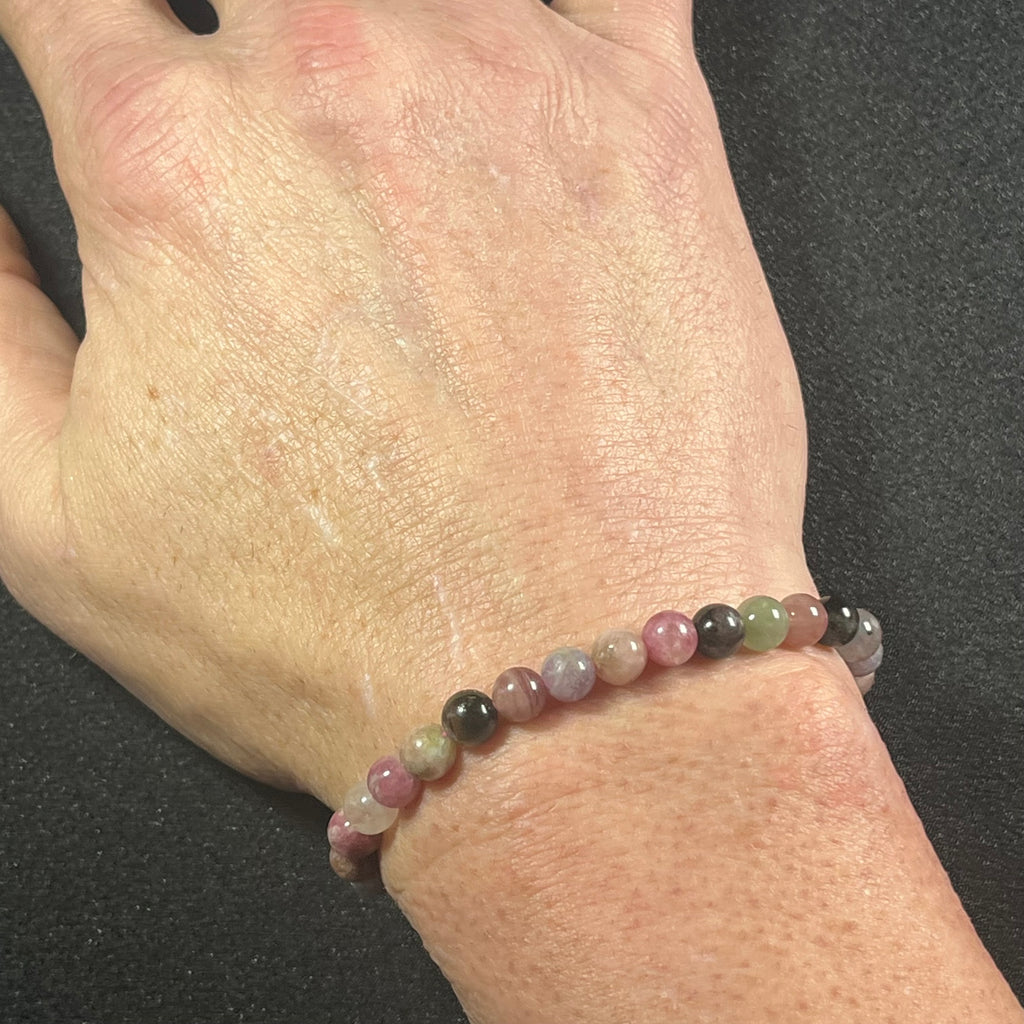 Tourmaline smooth round 6mm bead stretch bracelet; October birthstone