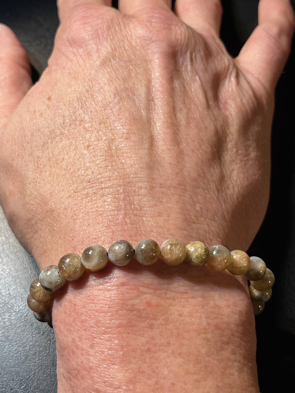 Black Sunstone smooth round 7mm bead stretch bracelet (AA grade)